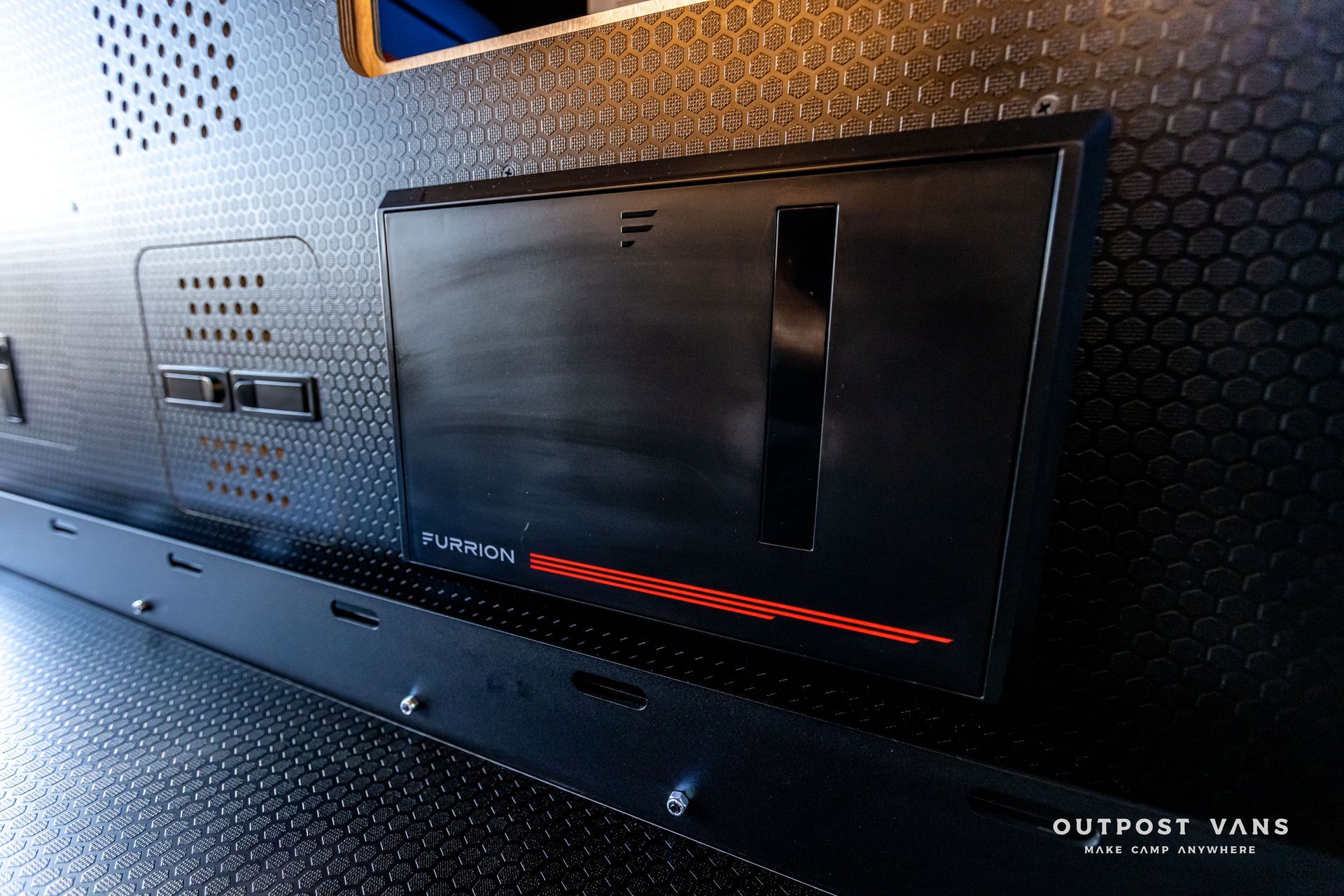 A black box with the word outpost on it