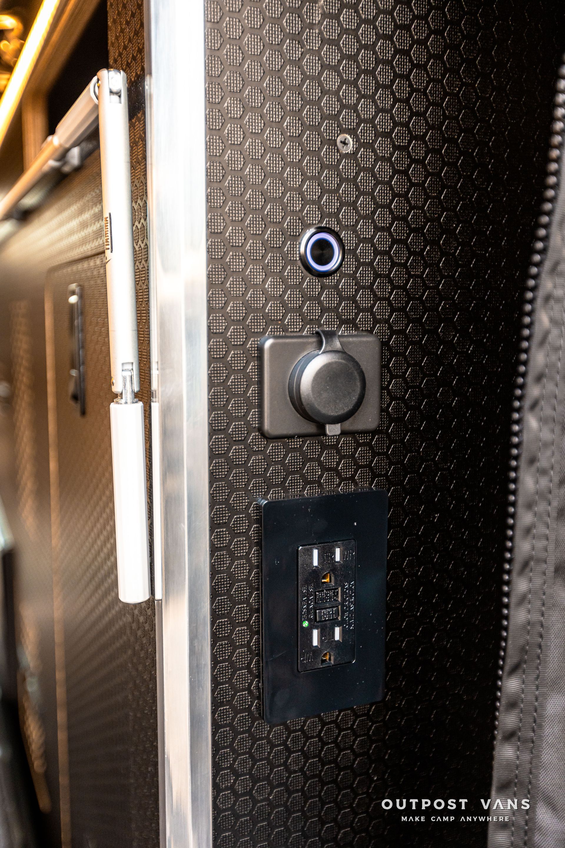 A close up of a electrical outlet on a wall.