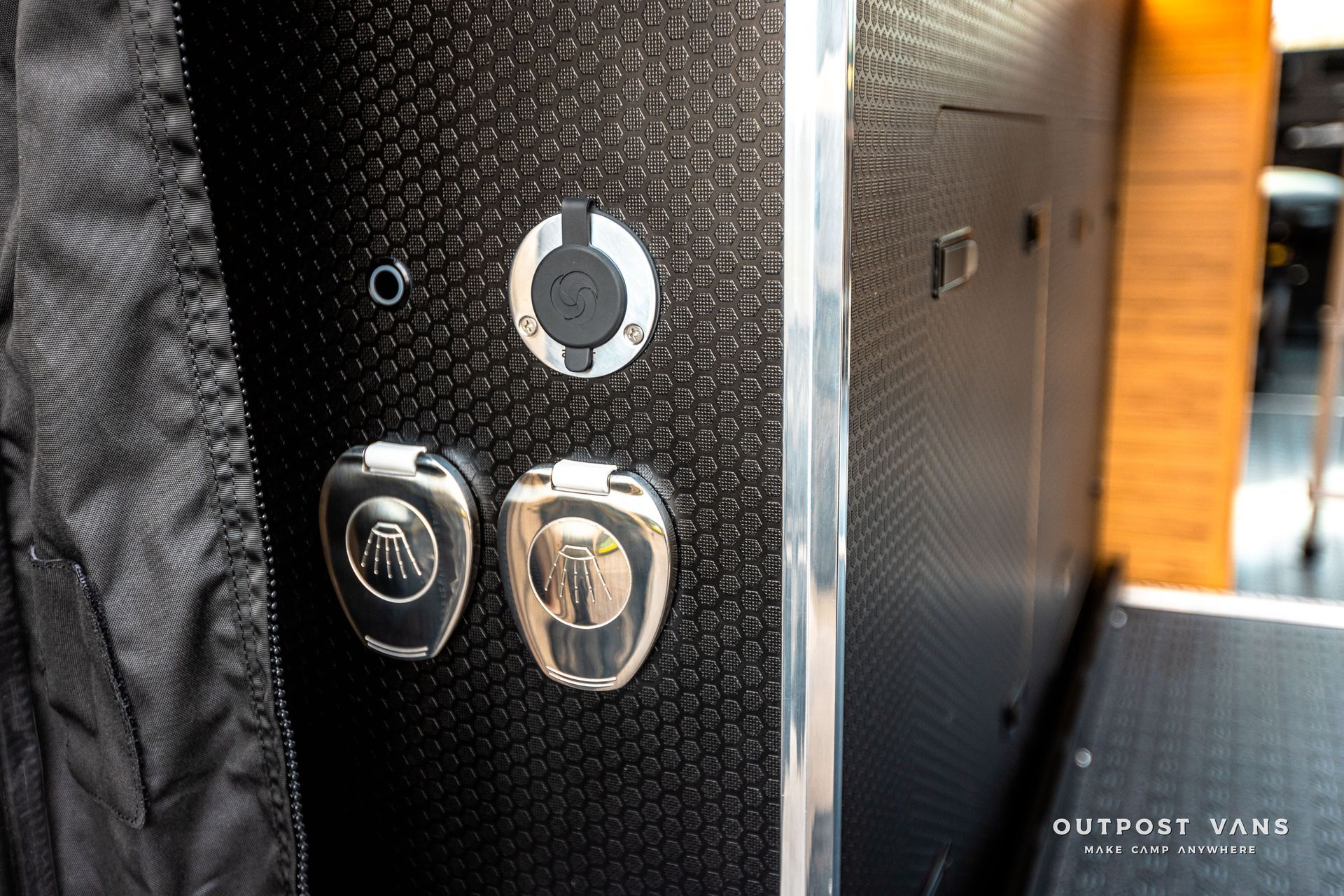 A close up of a door with two buttons on it