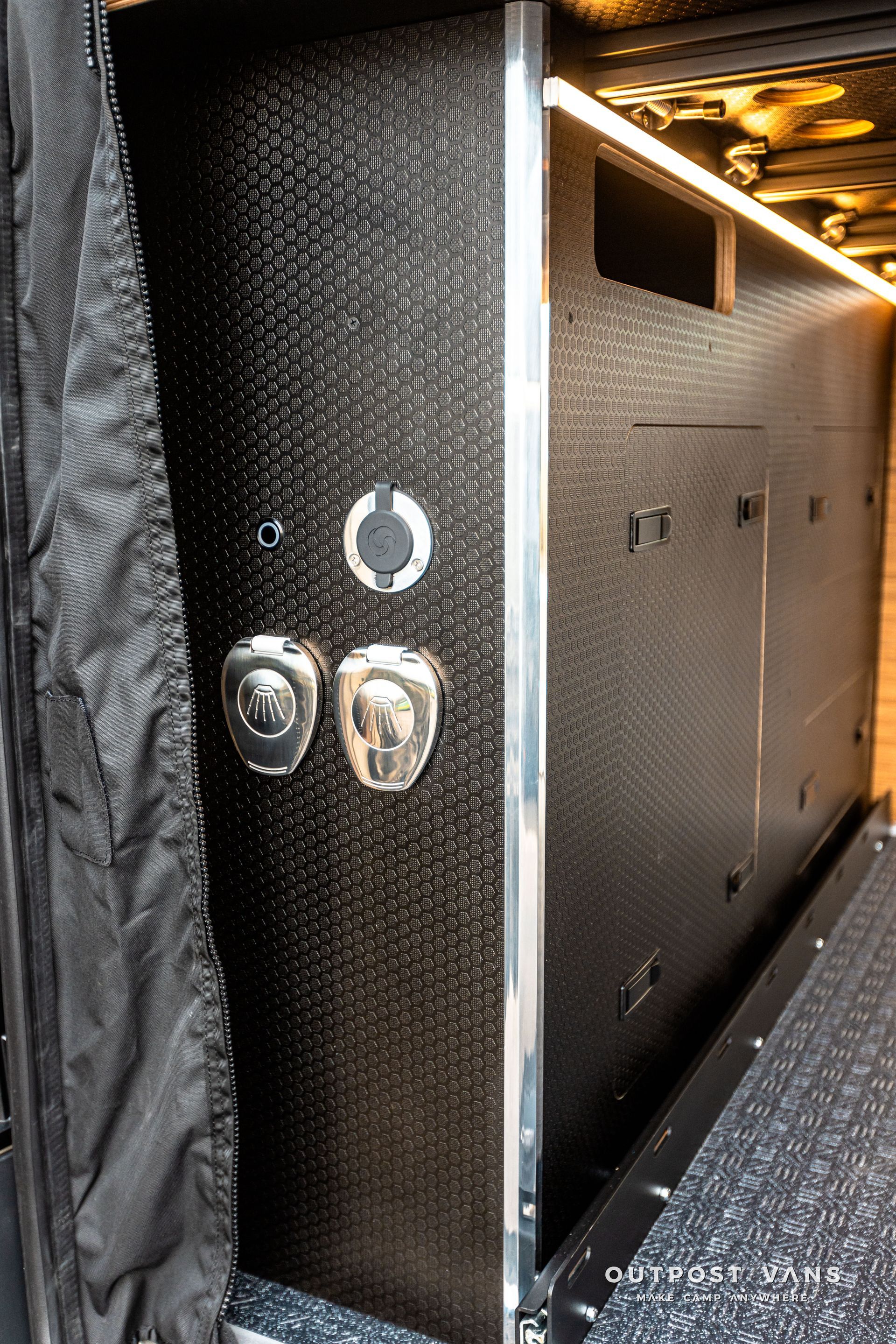 A close up of a door with two buttons on it.