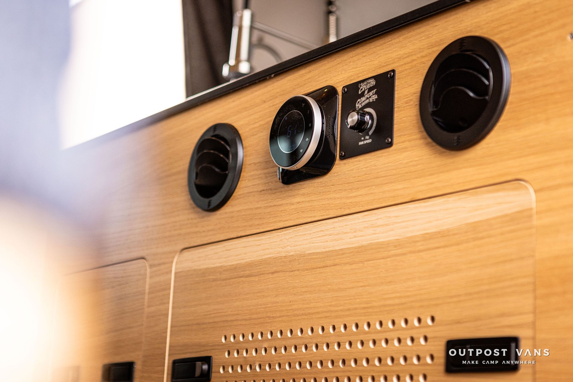 A wooden wall with a bunch of electrical outlets on it.