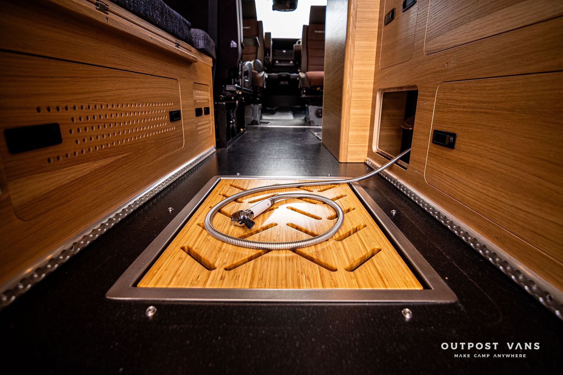 A wooden floor with the word outpost on it