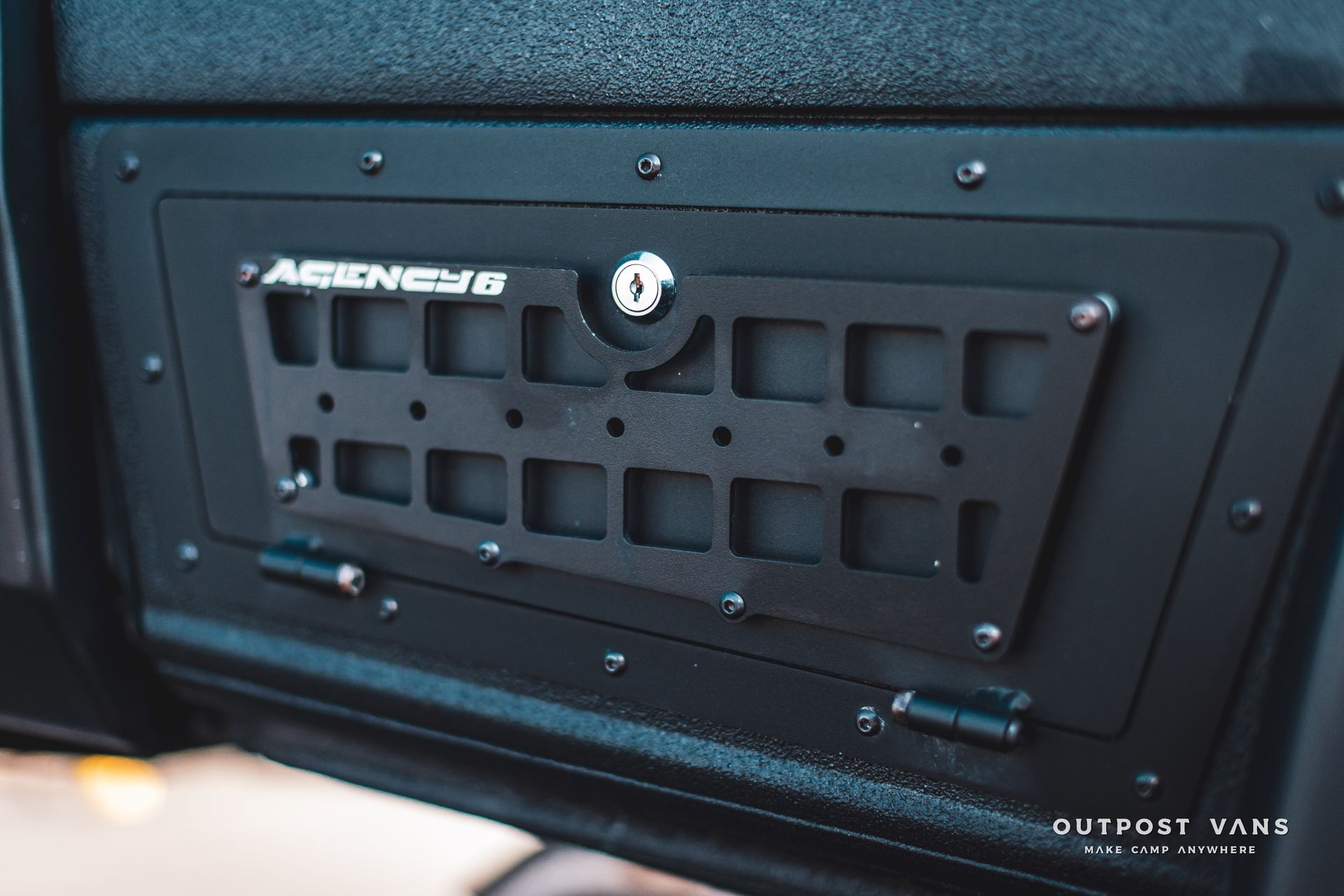 A close up of a black box with a lock on it.