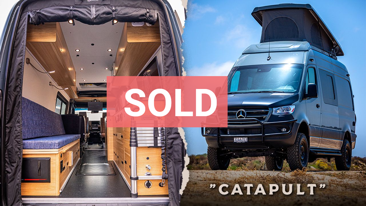 a white van is parked on the side of the road .