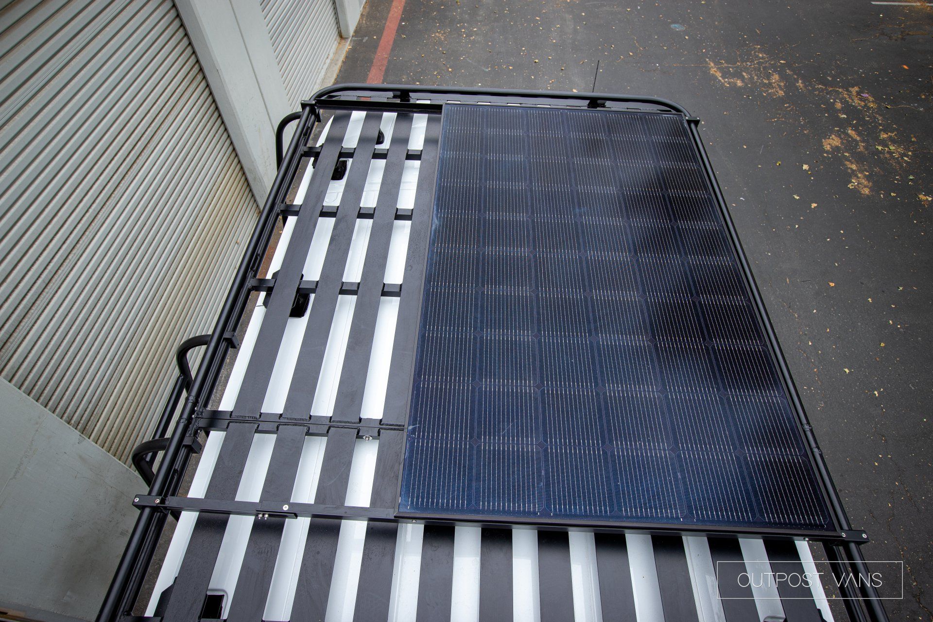 a roof rack with a solar panel attached to it