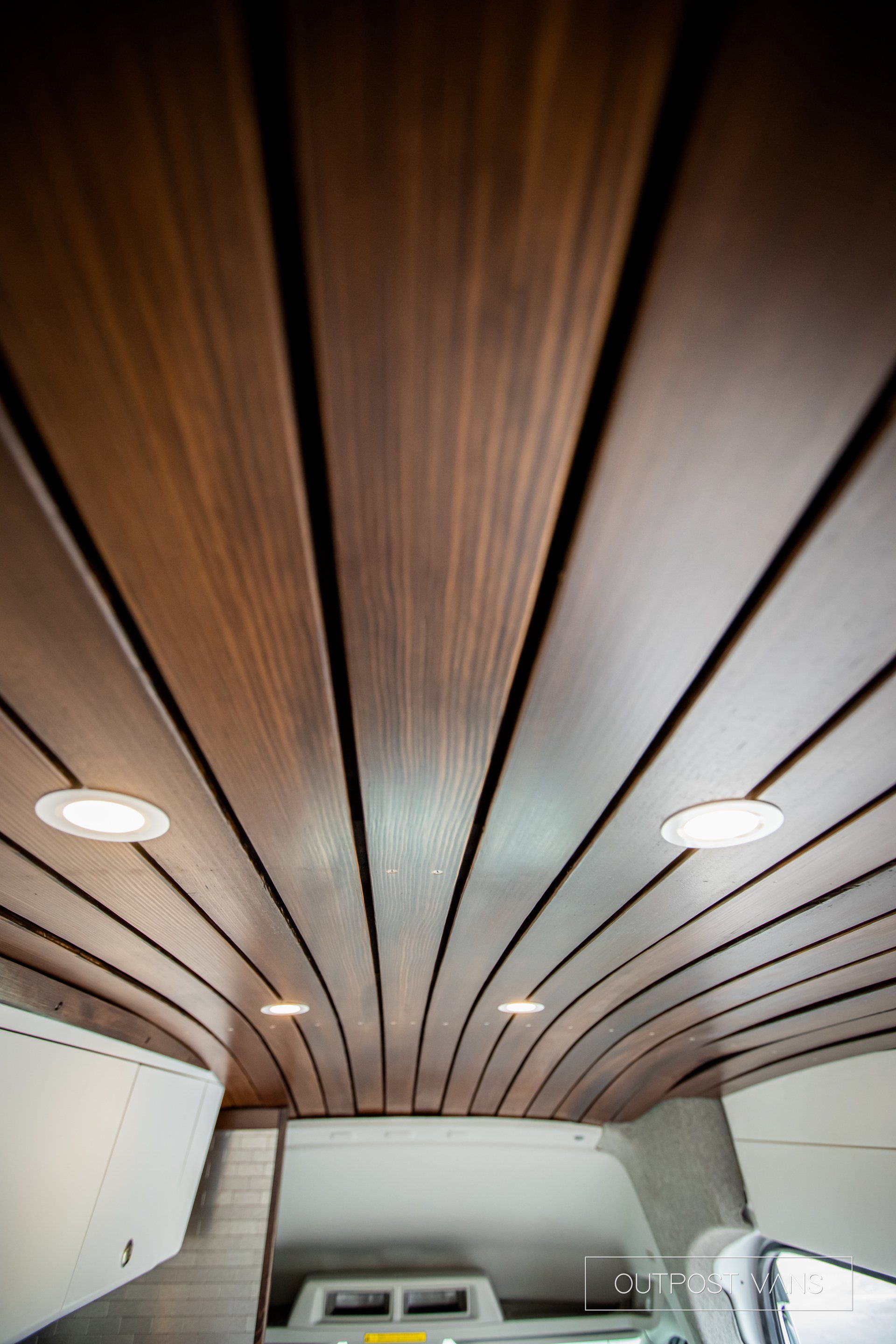 a close up of a wooden ceiling in a room .