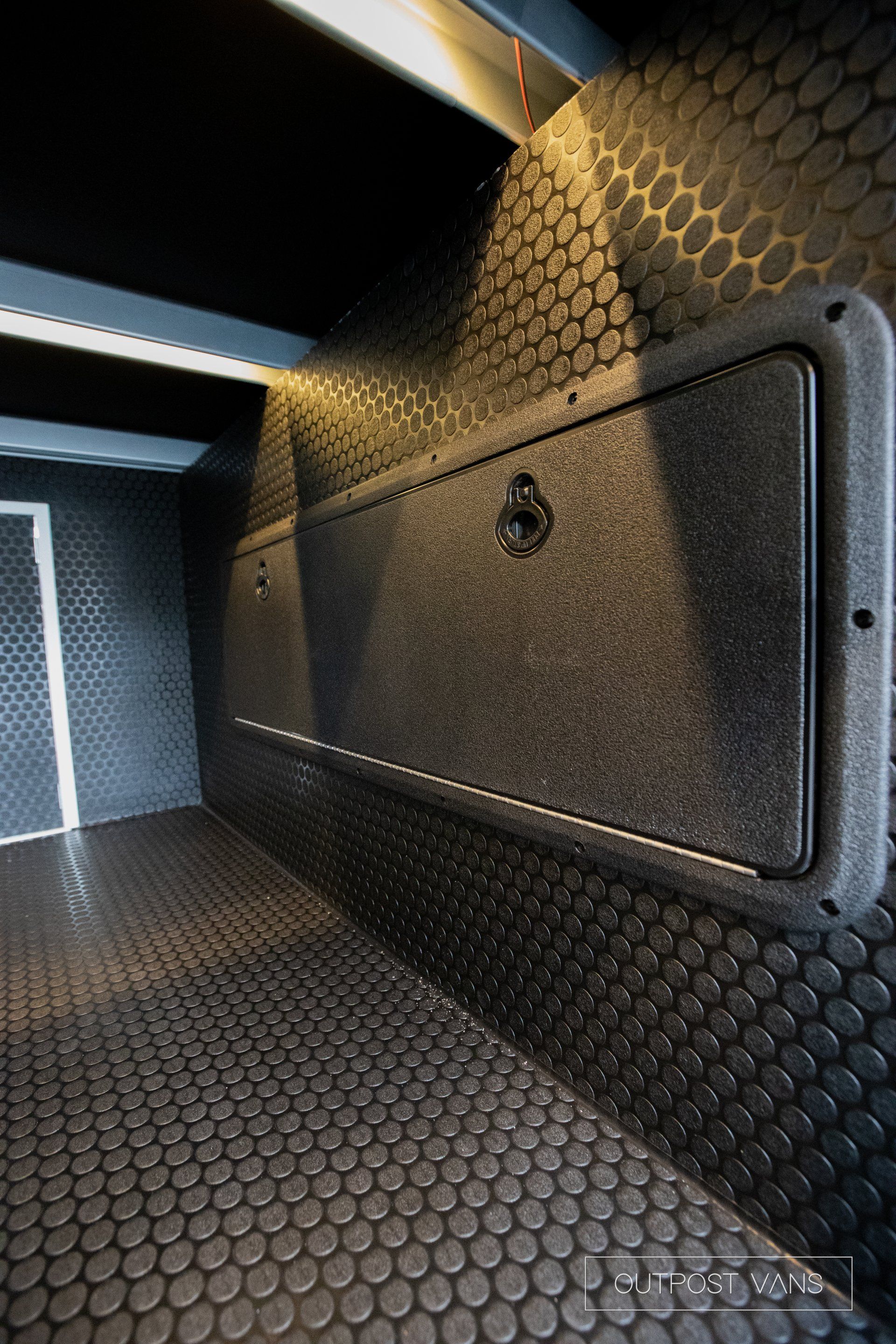 a close up of a door in a room with a rubber floor .