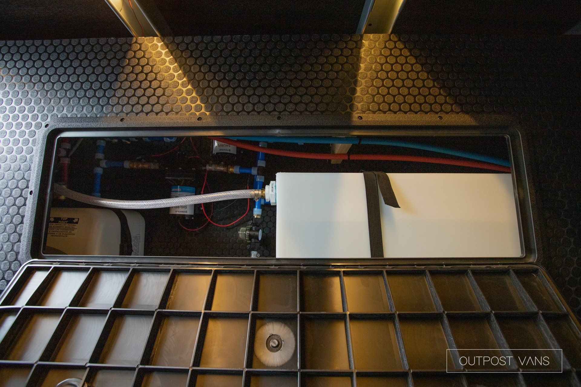 a black box with a white container inside of it