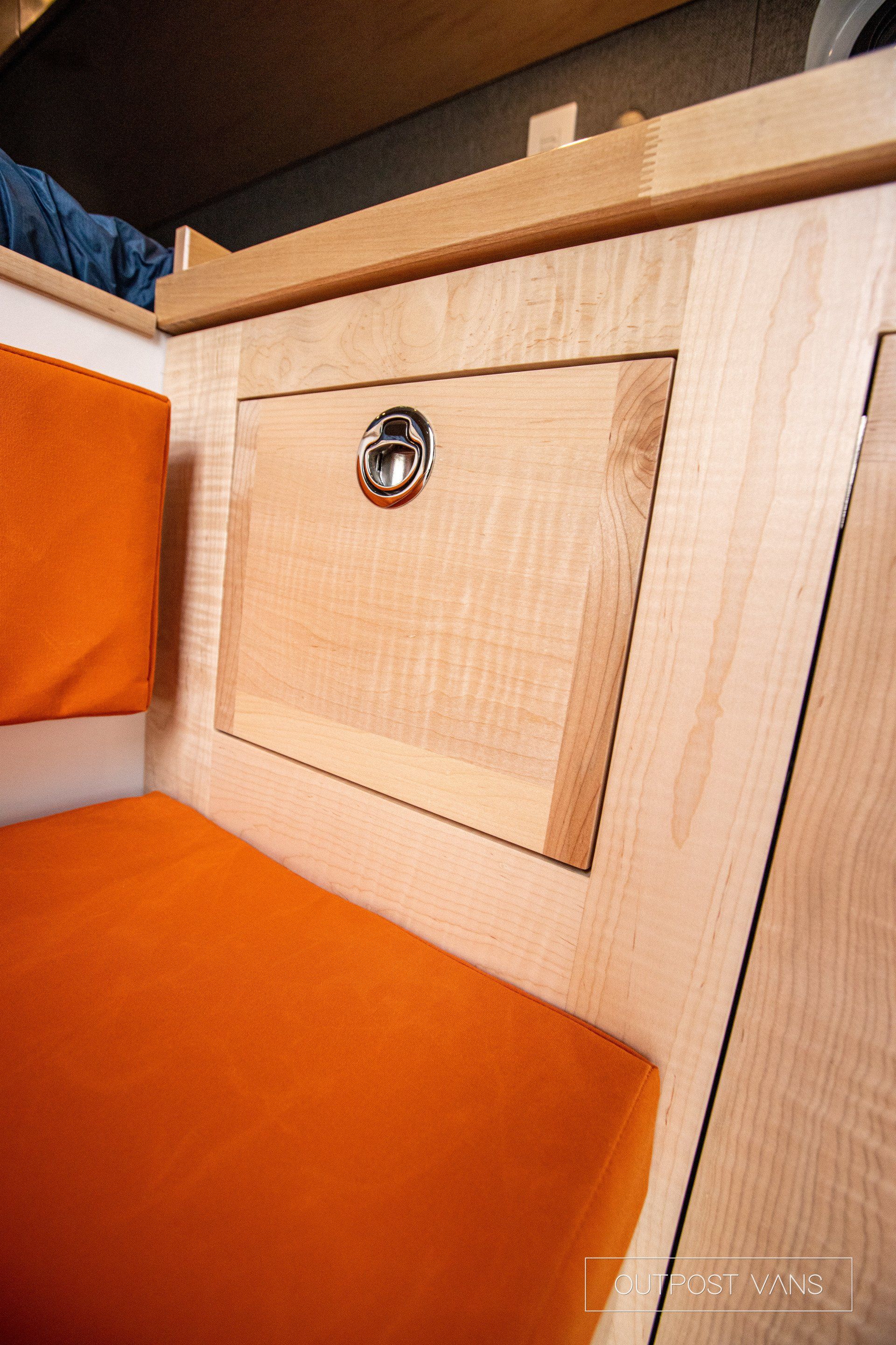 a close up of a wooden cabinet with a lock on it .