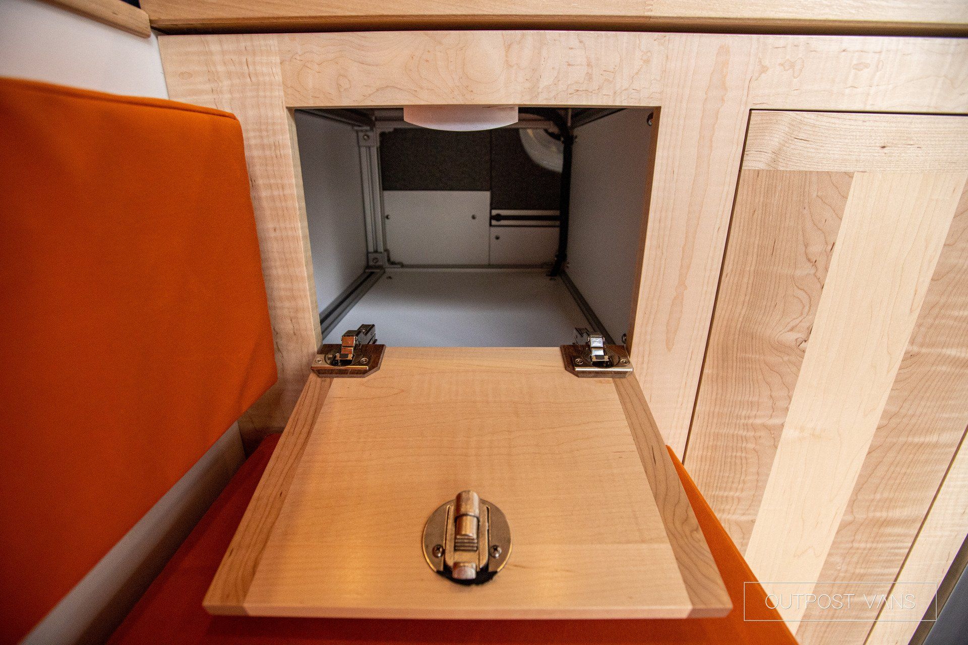 a wooden cabinet with a door open and a lock on it