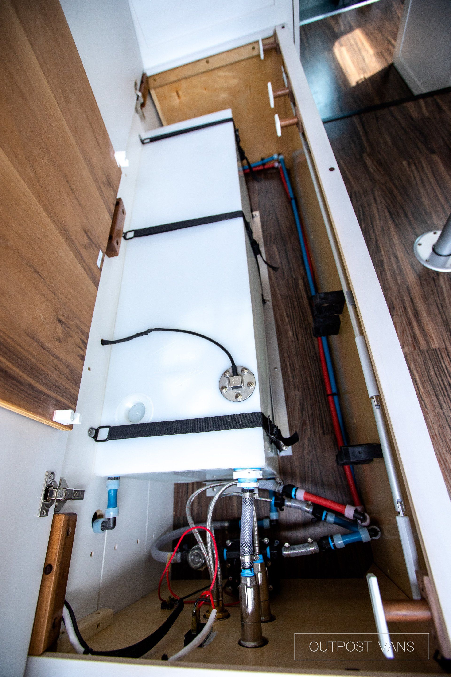 A kitchen with a sink and a stove in it.
