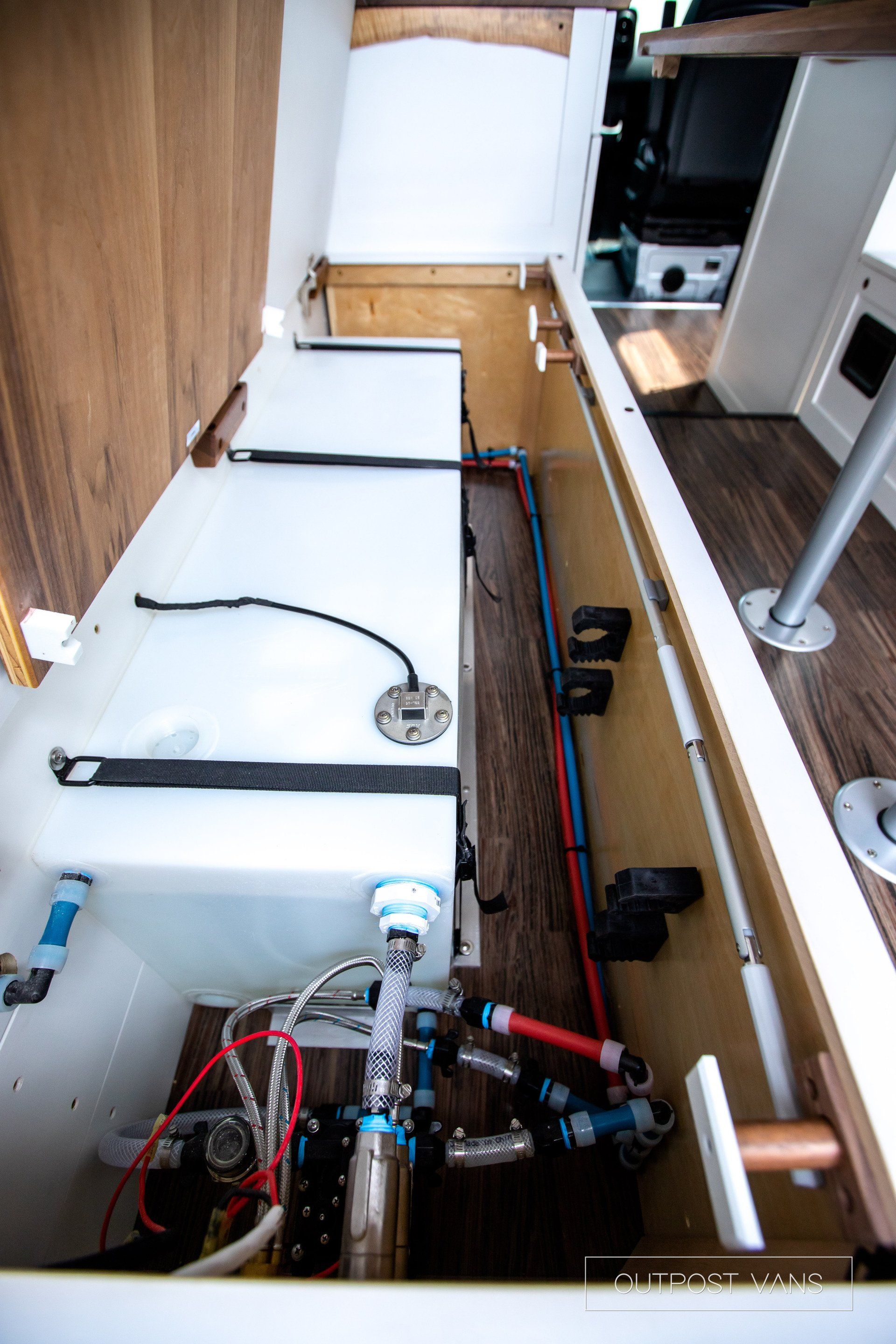 A kitchen with a sink and a stove in it.