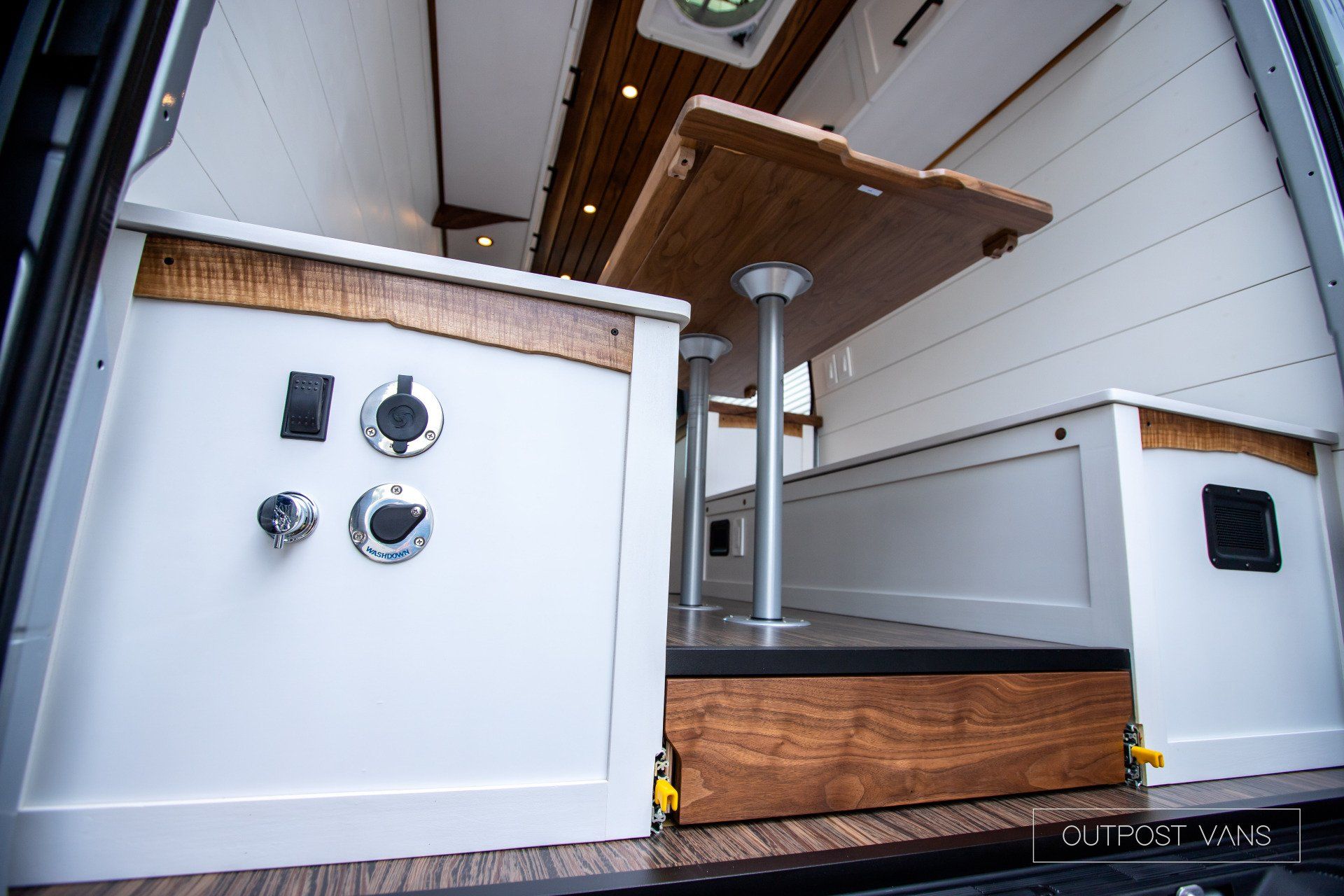 There is a table in the back of a van.