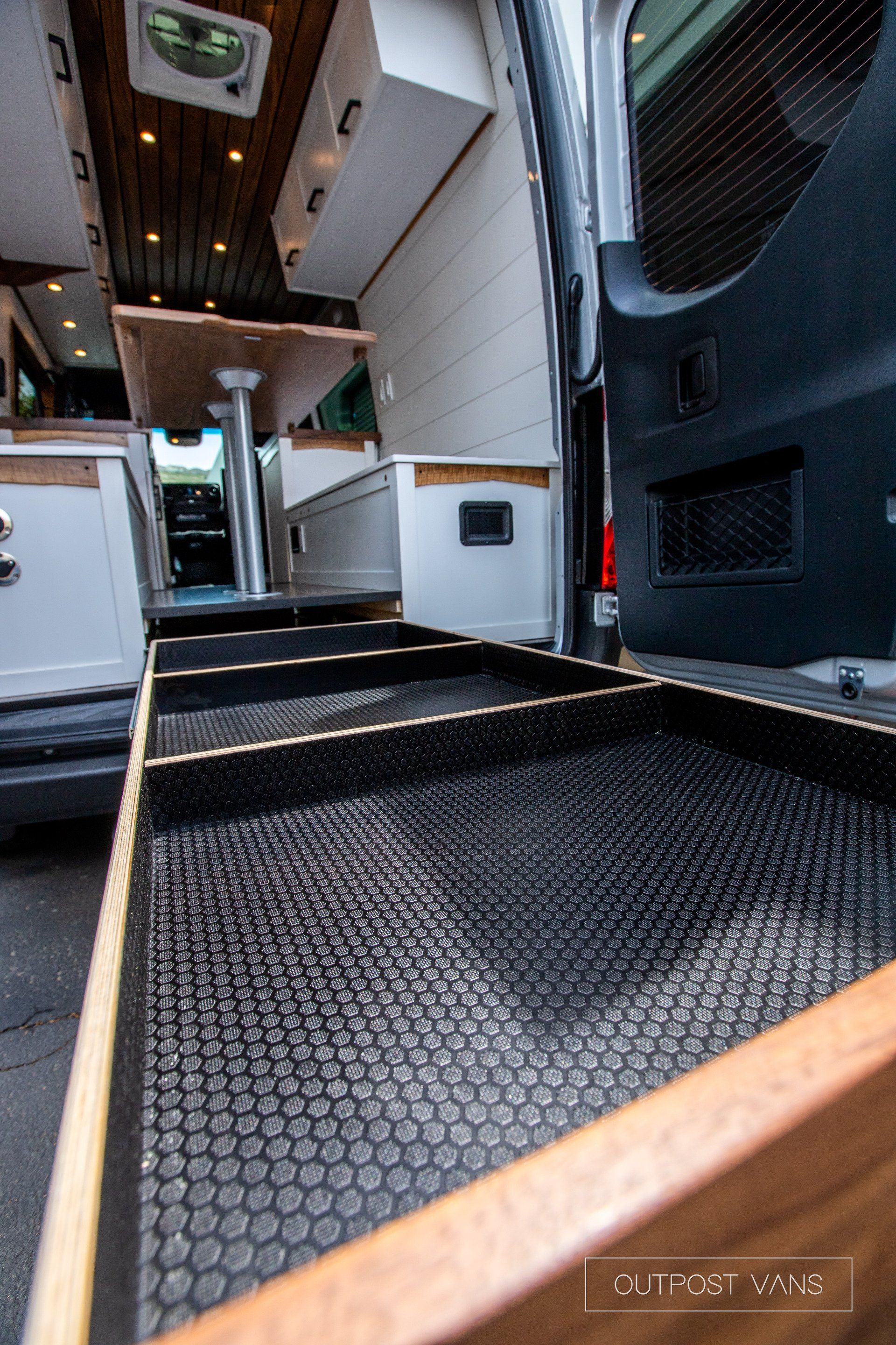 A van with a ramp in the back of it.