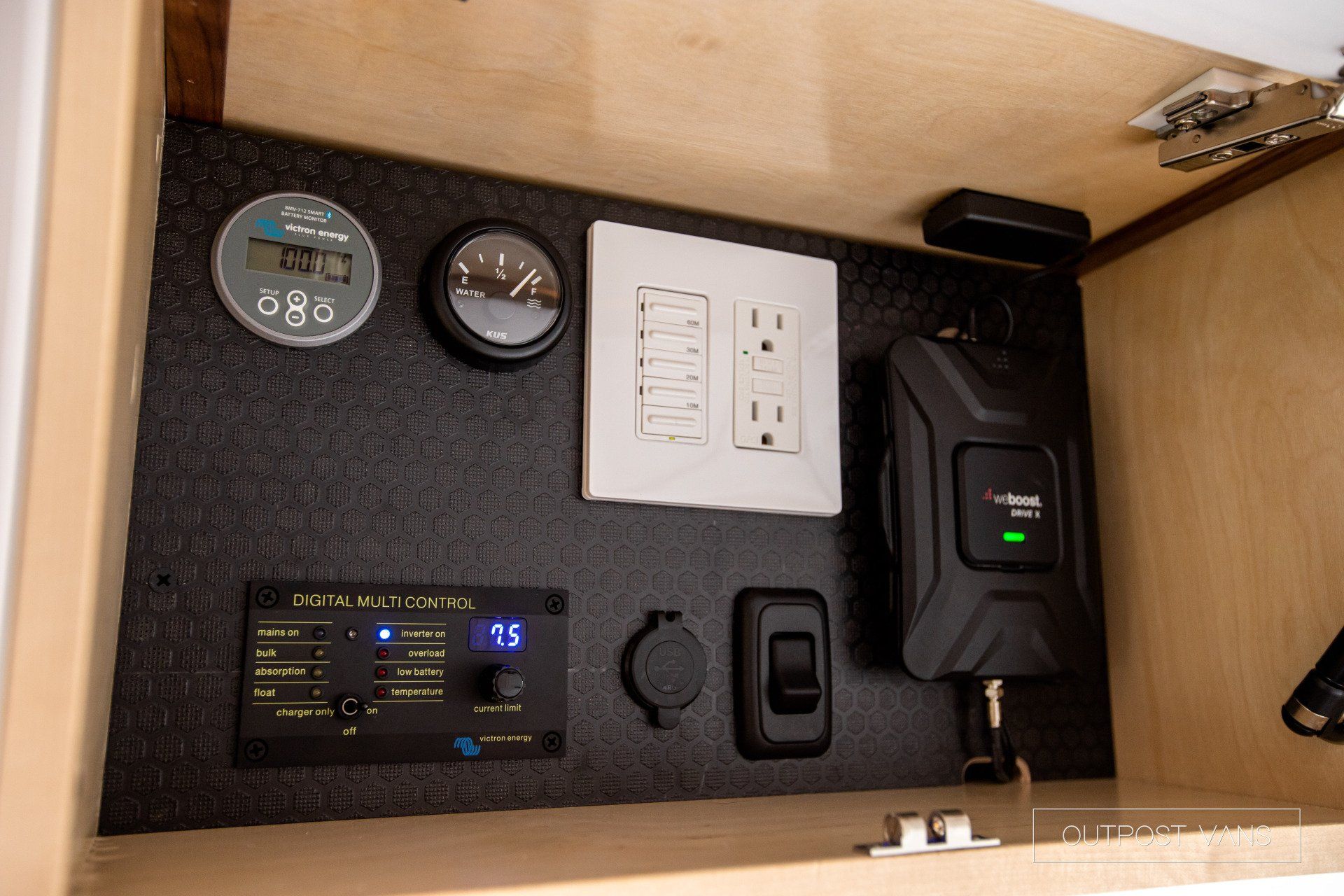 A cabinet with a bunch of electrical equipment on it
