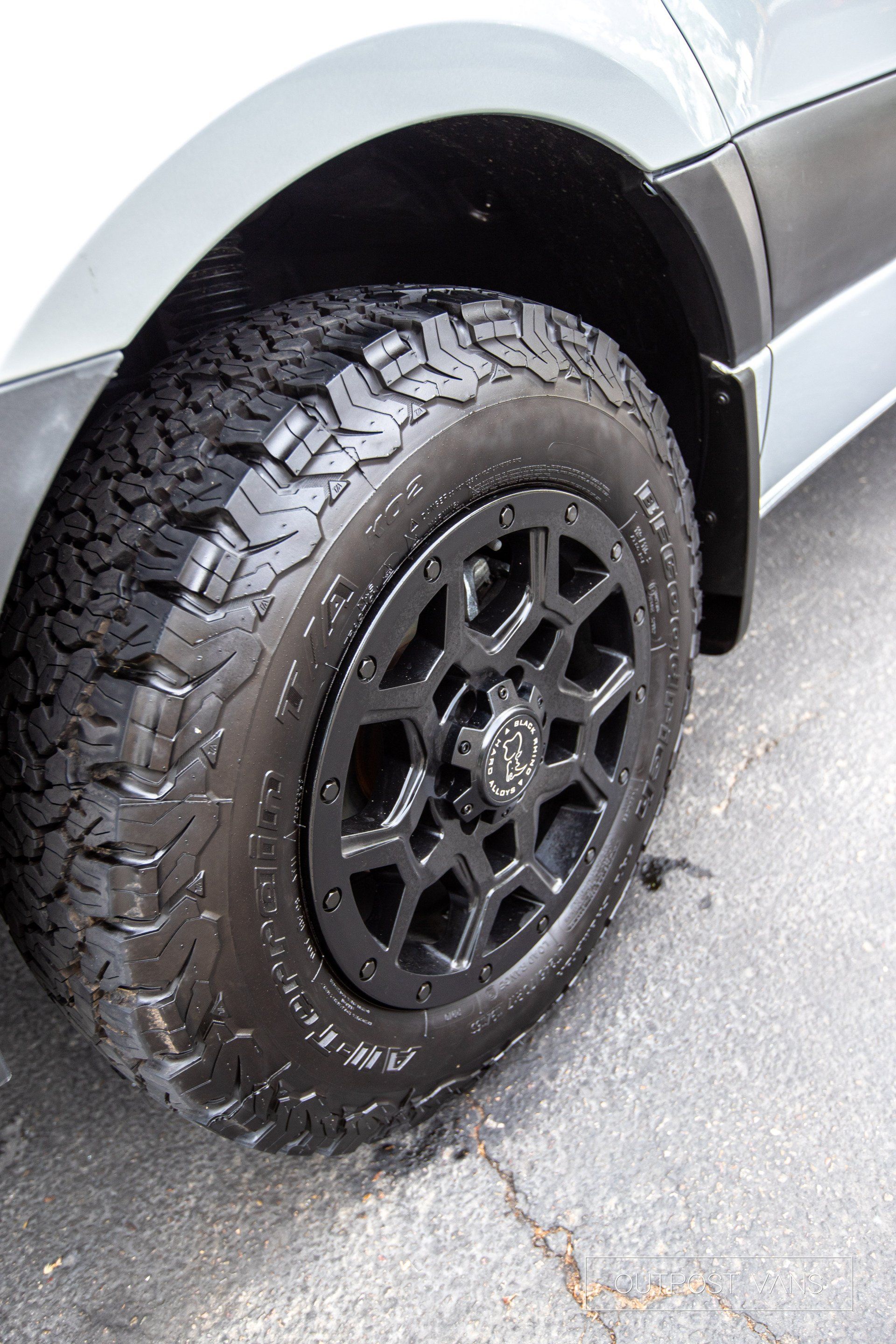 A close up of a car wheel with a tire on it.