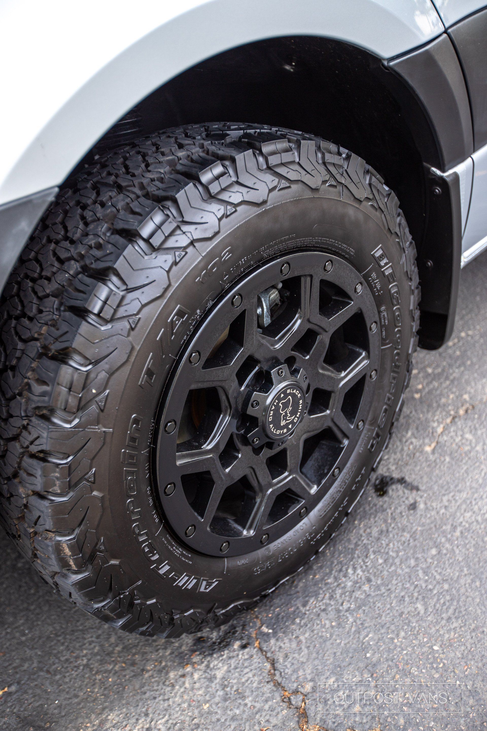 A close up of a car wheel with a tire on it.