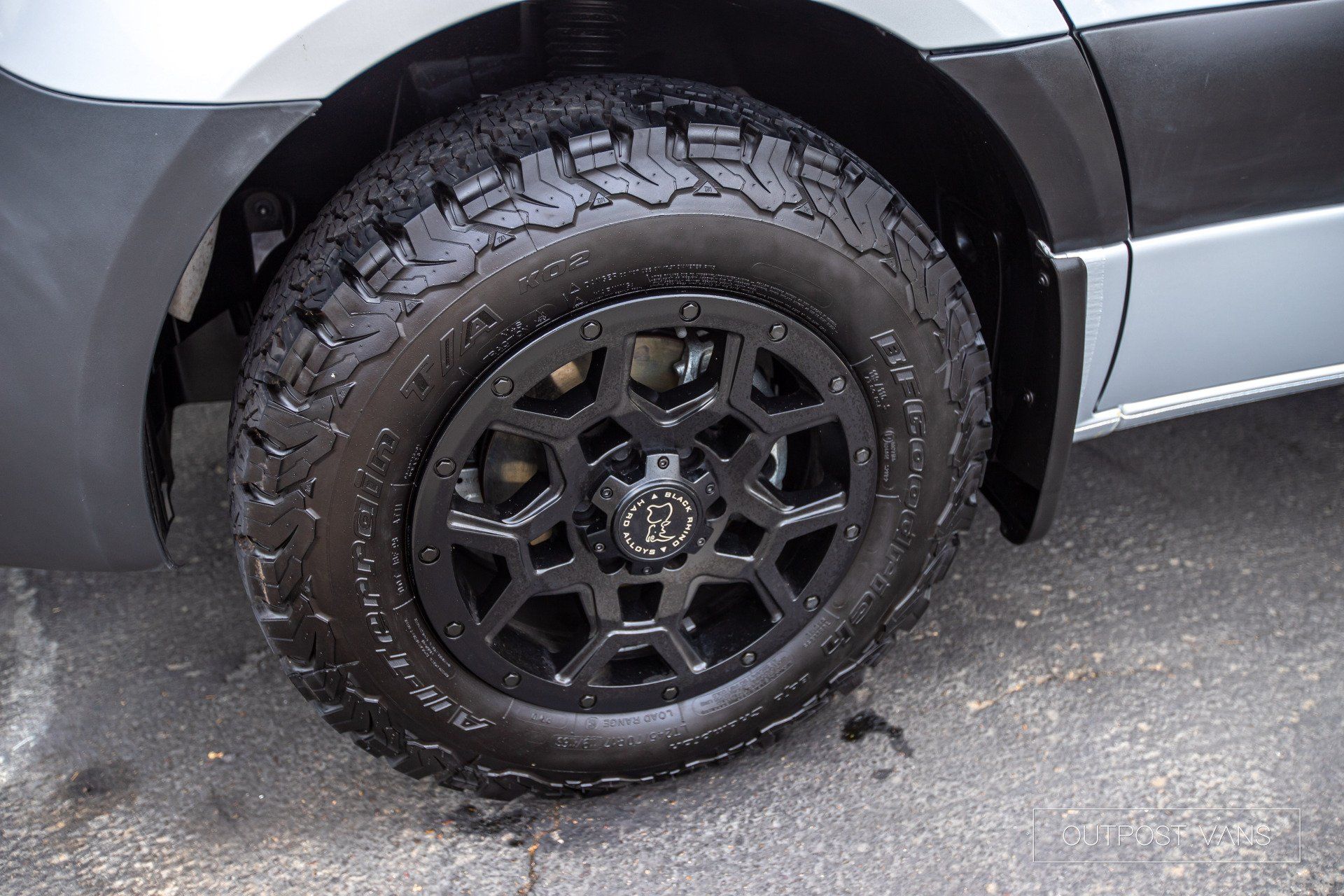 A close up of a car wheel with a tire on it.