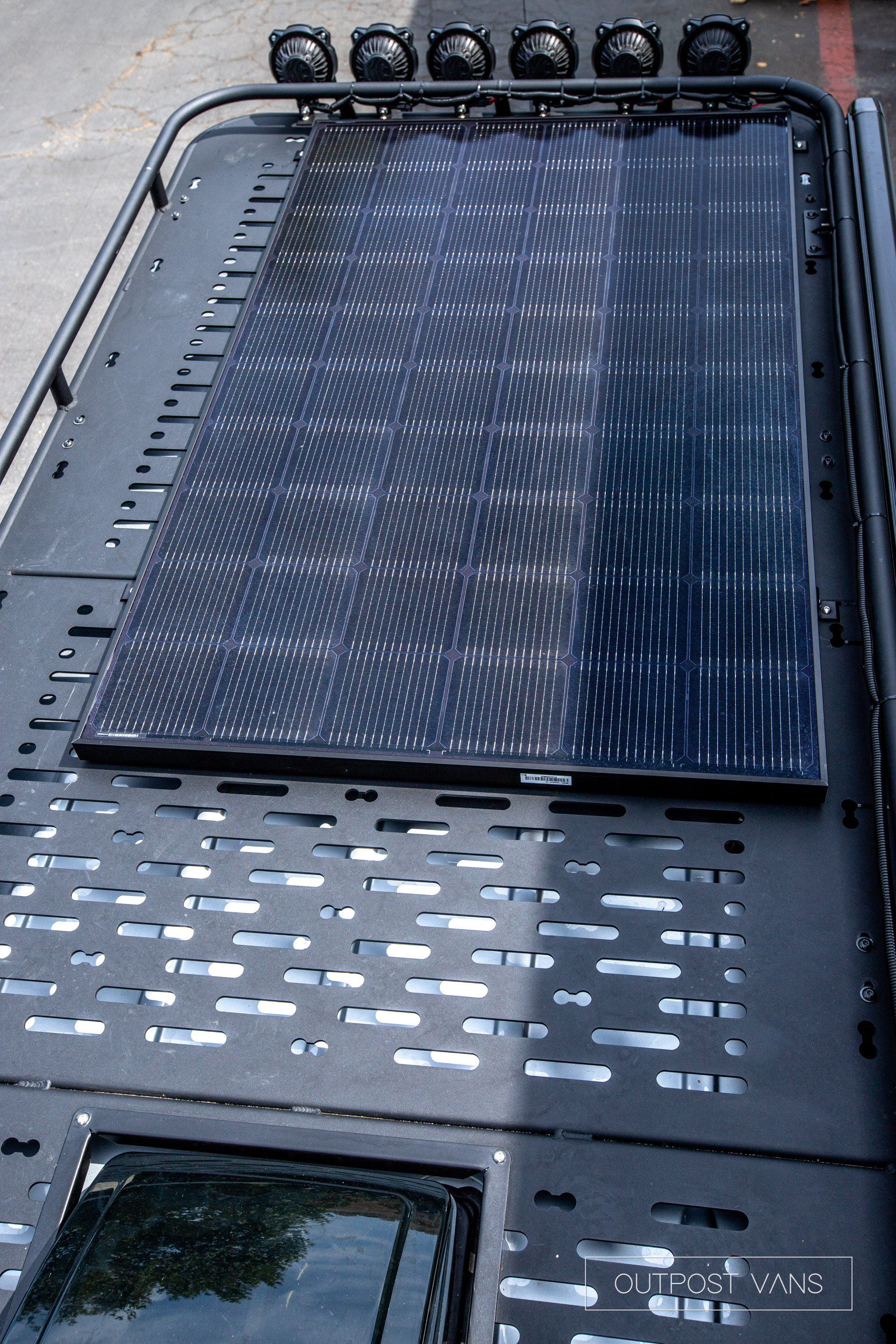 A solar panel is mounted on the roof of a vehicle.