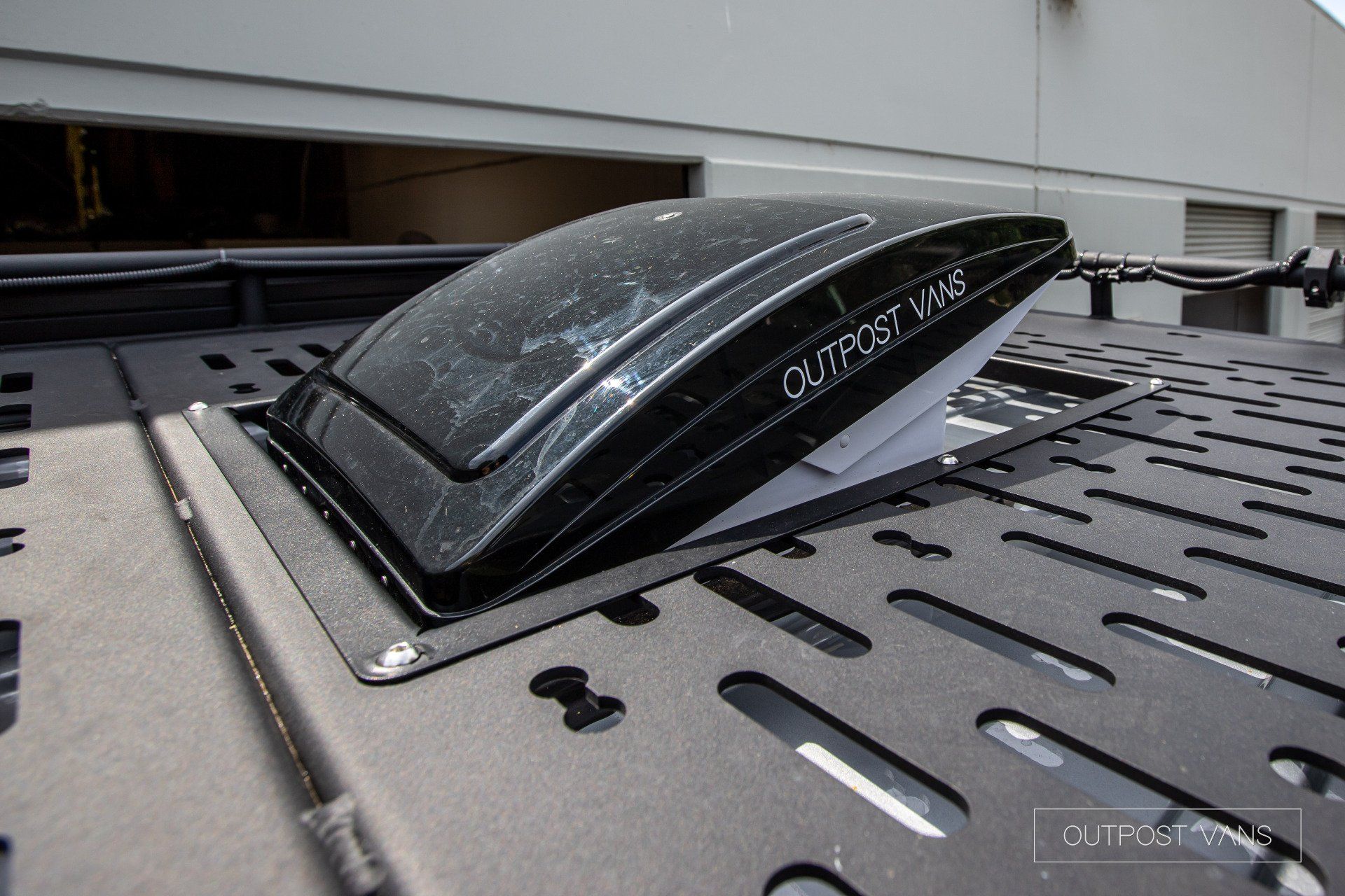 A close up of a vent on the roof of a vehicle.