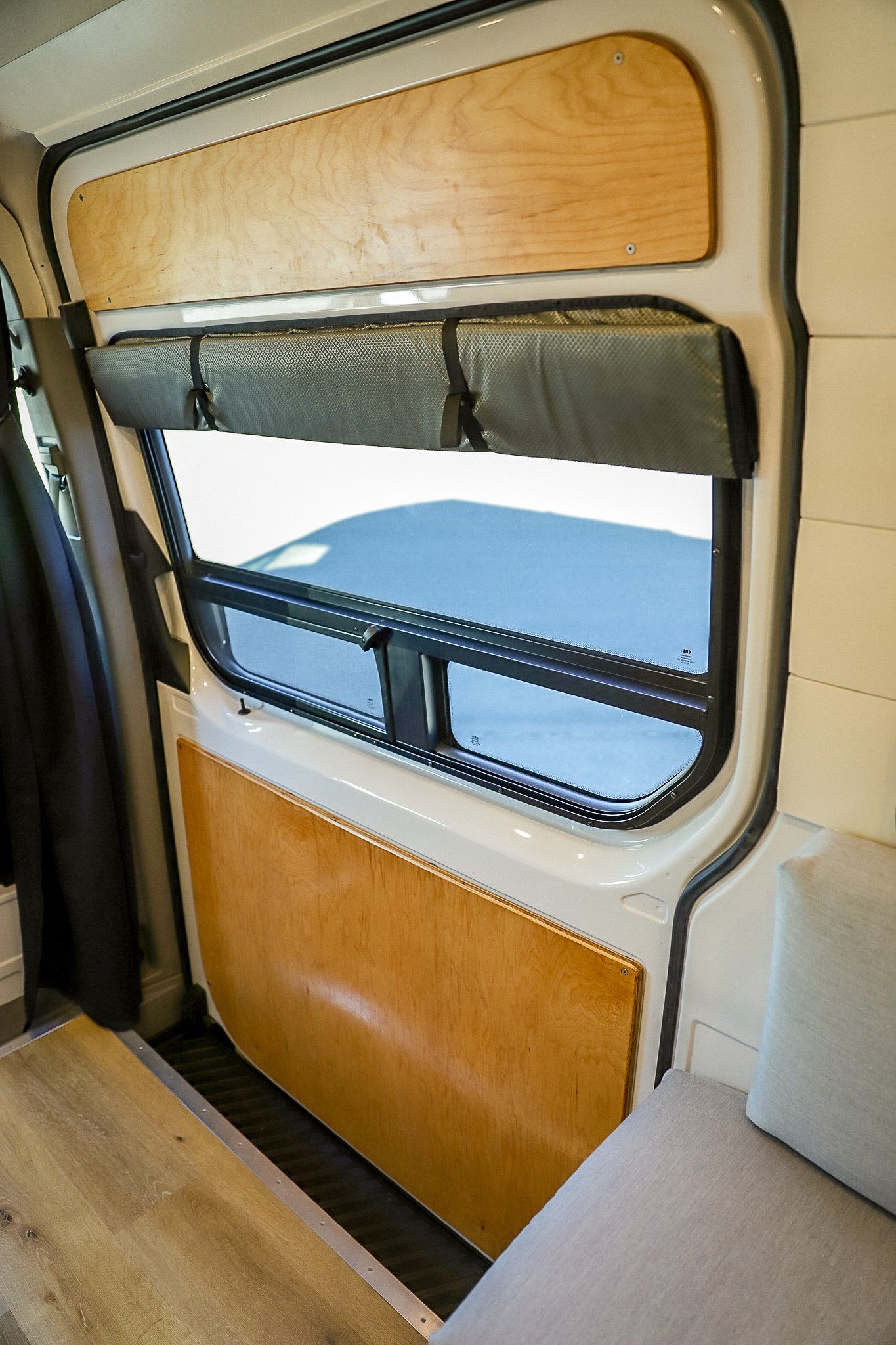 the inside of a van with a table and a window .