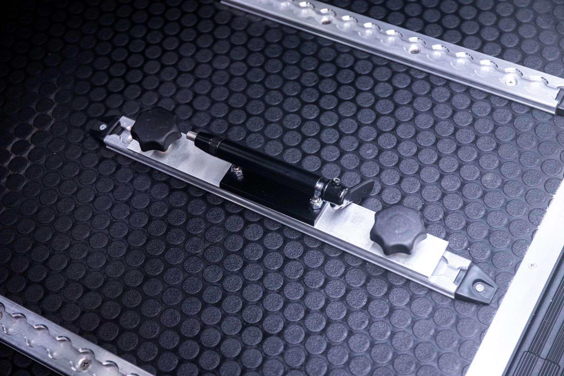 a close up of a metal item on a black surface