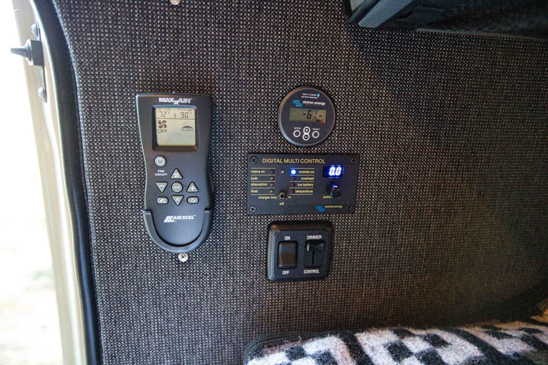 A remote control is on the side of a vehicle