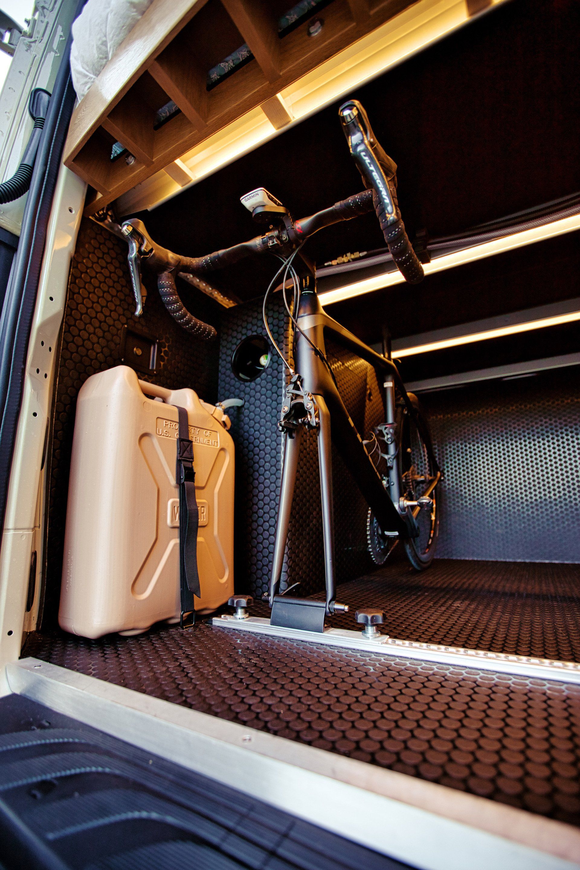 A bicycle is sitting in the back of a van.