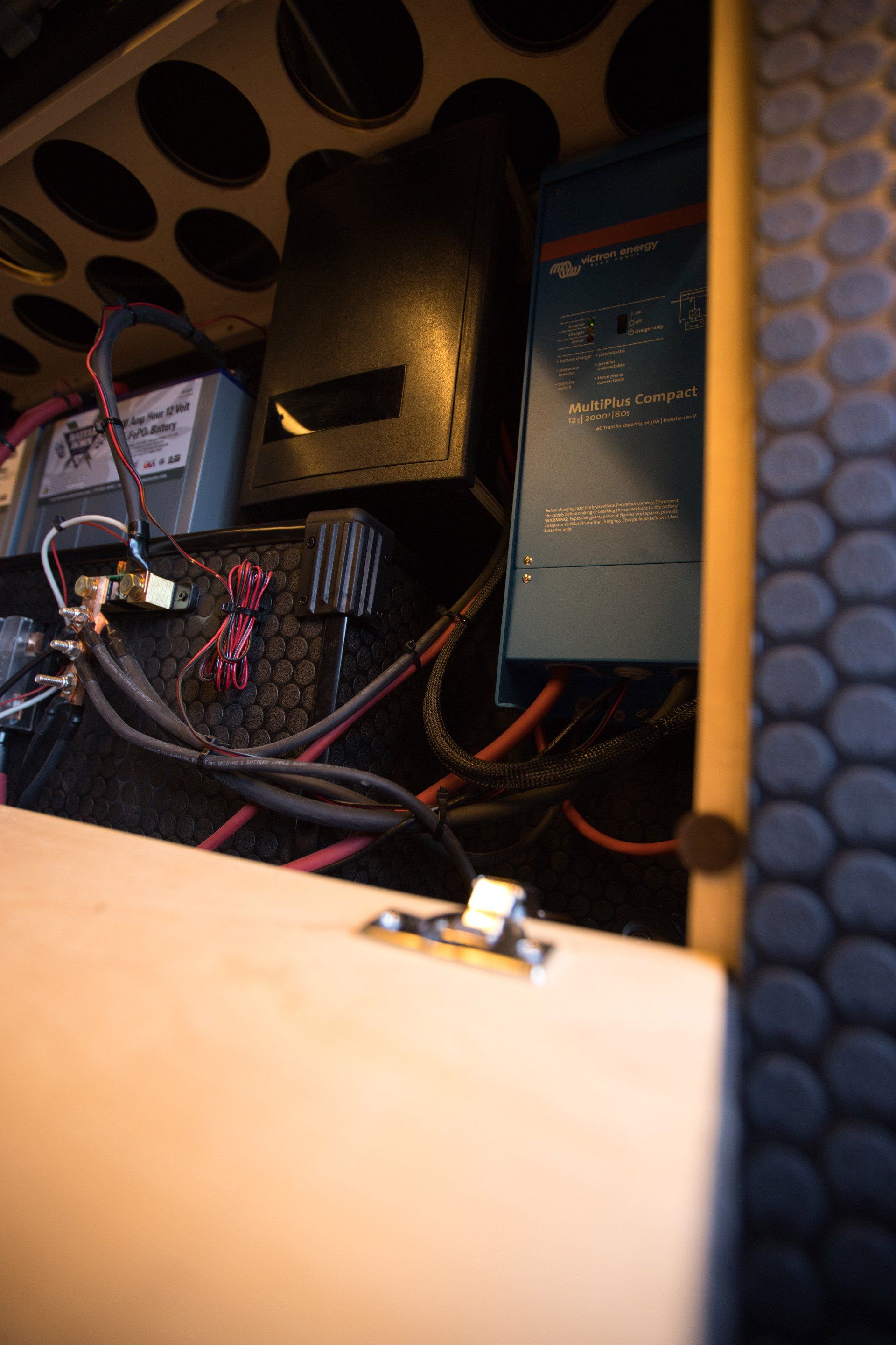 A close up of a box with a bunch of wires coming out of it.