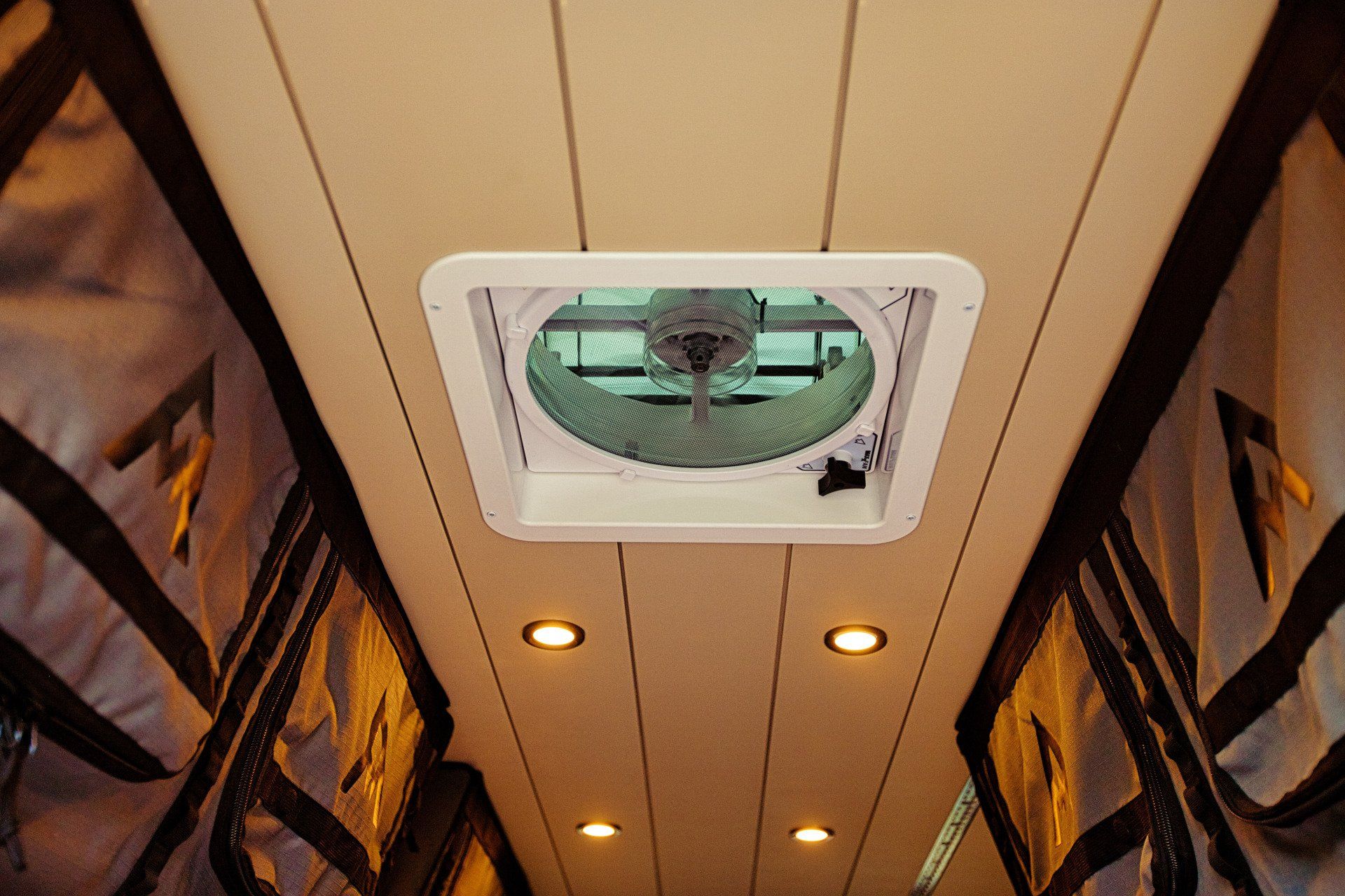 A ceiling fan is hanging from the ceiling of a room