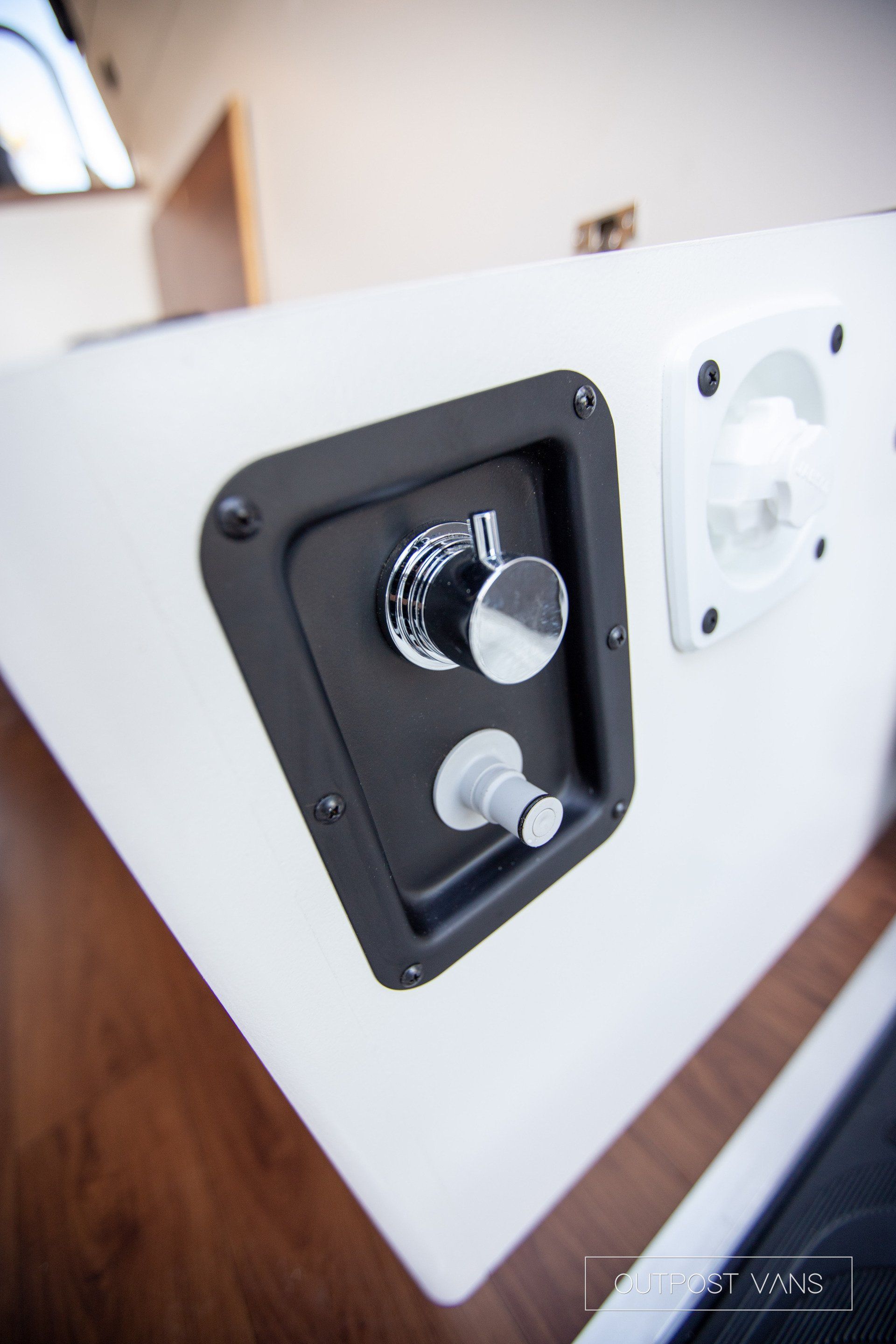 A close up of a speaker with a knob on it