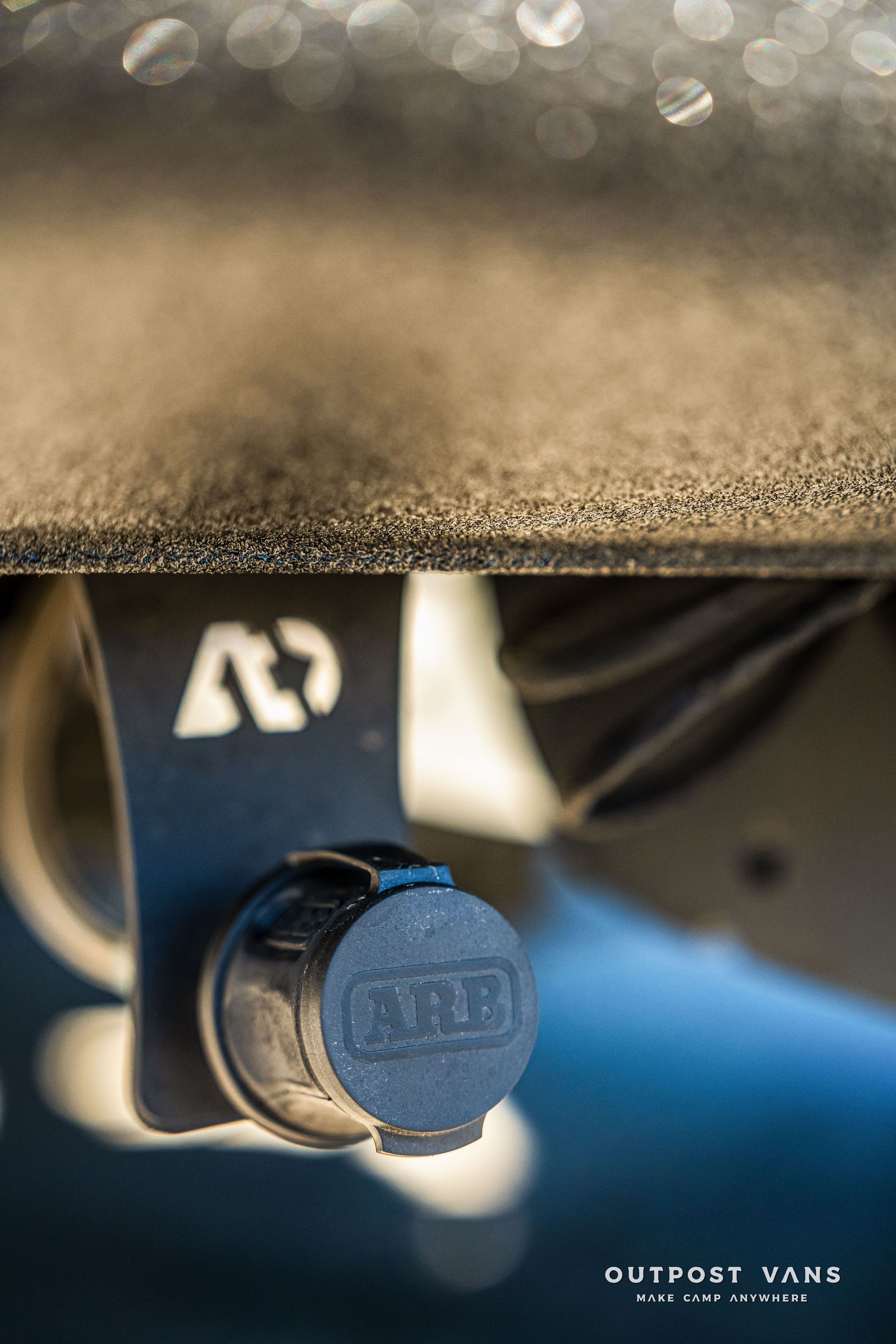 ARB air compressor outlet mounted on a vehicle.
