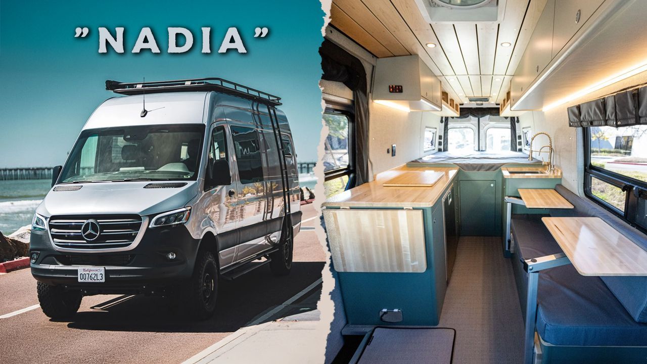 A van is parked in a parking lot in front of a wave.