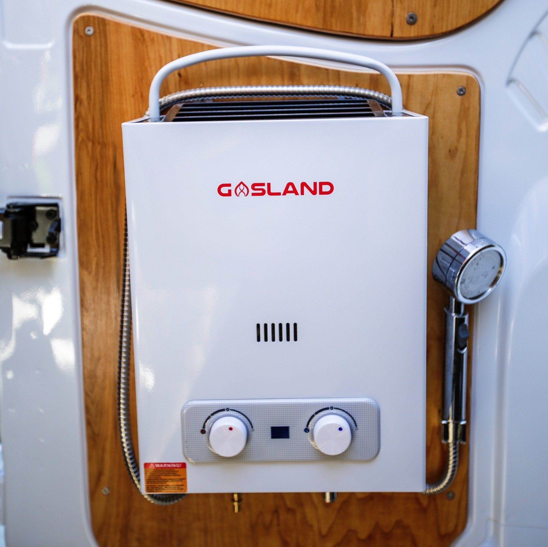 a gasland water heater with a shower attached to it