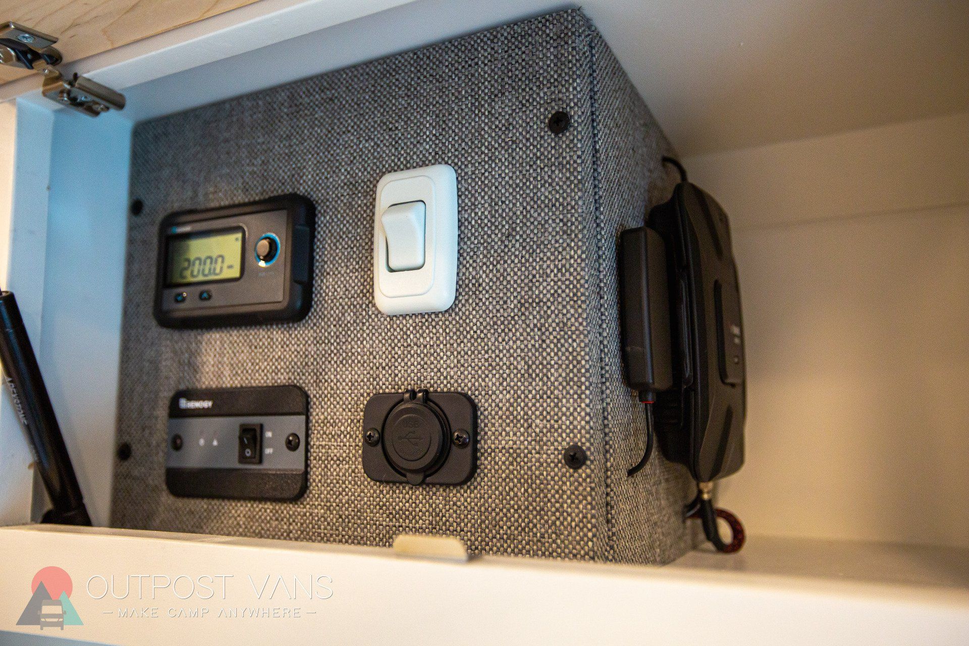 there are a lot of electrical outlets and a clock on the wall .