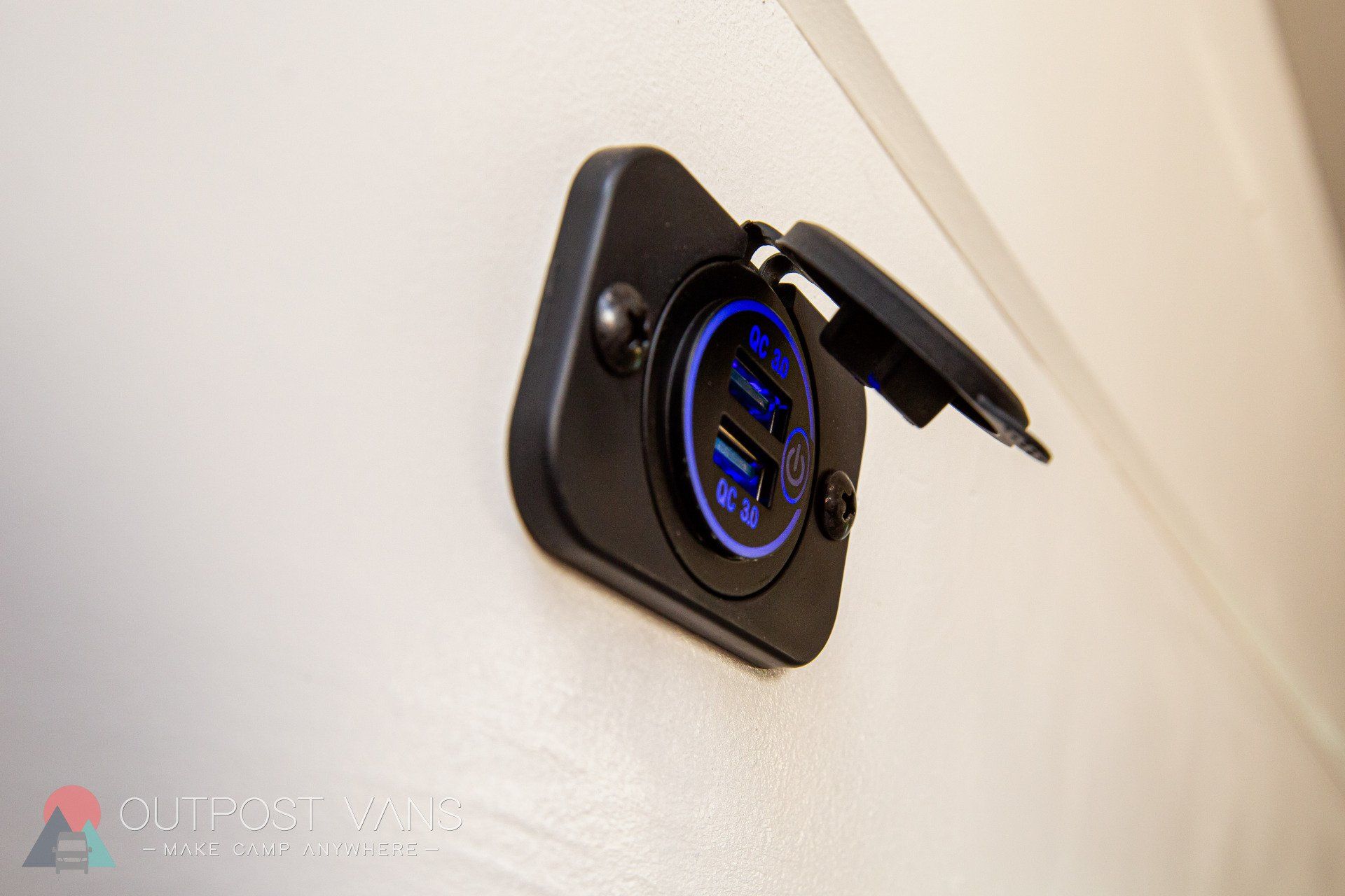 a close up of a charger plugged into a wall .