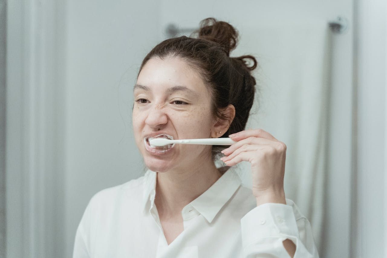 woman brushing teeth