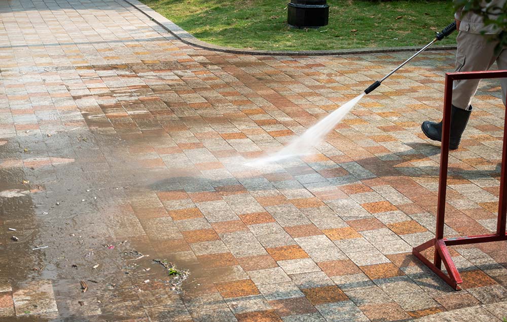 Permeable driveway in Richmond London being jet washed