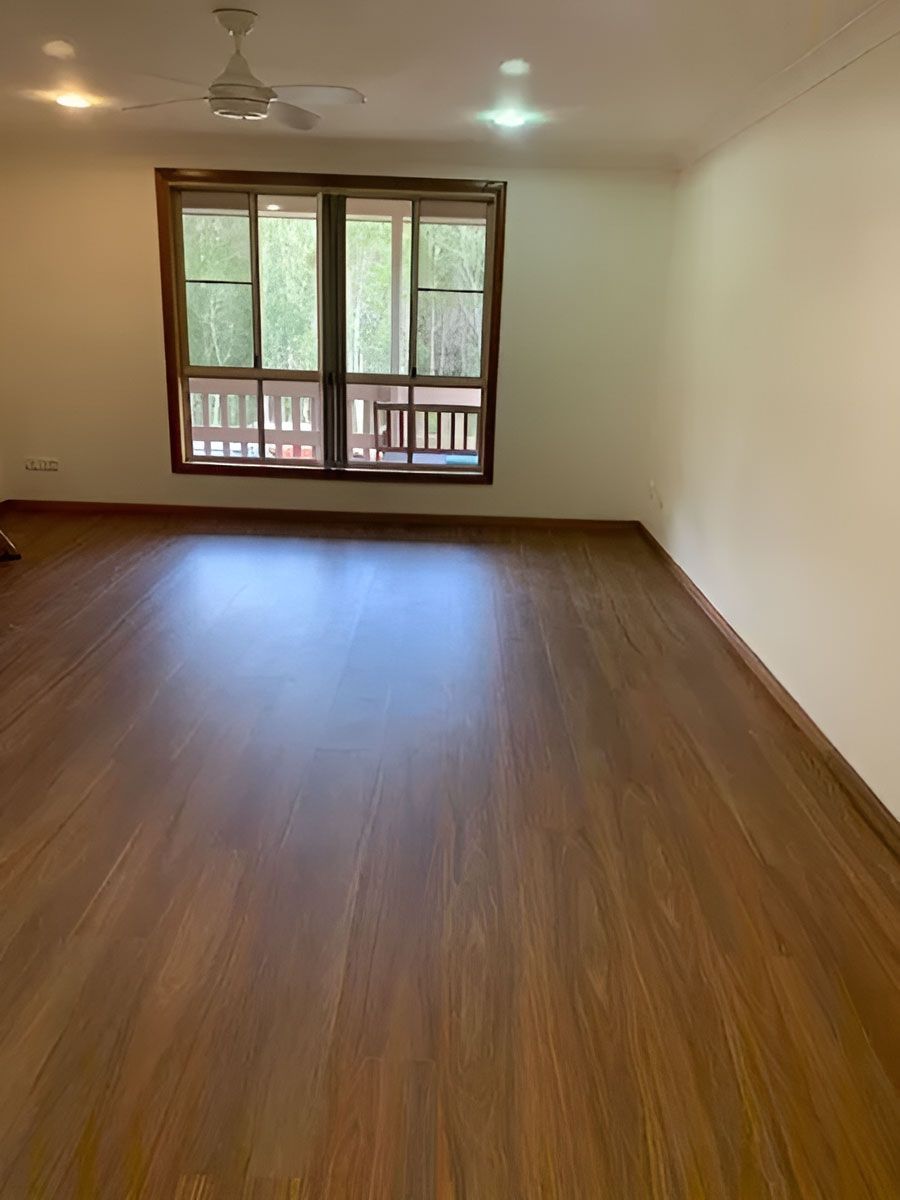 Empty Living Room With Hardwood Floors — Flooring Direct Mid North Coast in South Kempsey, NSW