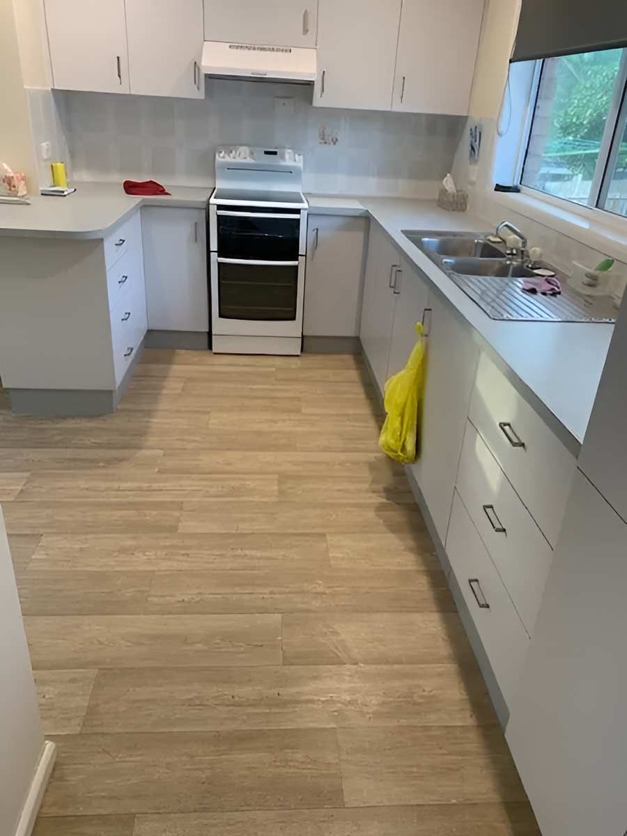 A Kitchen With Elegant Wooden Floors — Flooring Direct Mid North Coast in Macksville, NSW