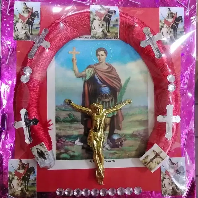 Red horseshoe frame with religious artwork: saint and crucifix. Pictures of a knight surround.