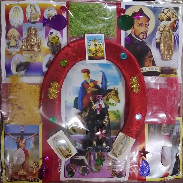 Shrine with various religious images, a horseshoe, and decorations in a clear plastic bag.