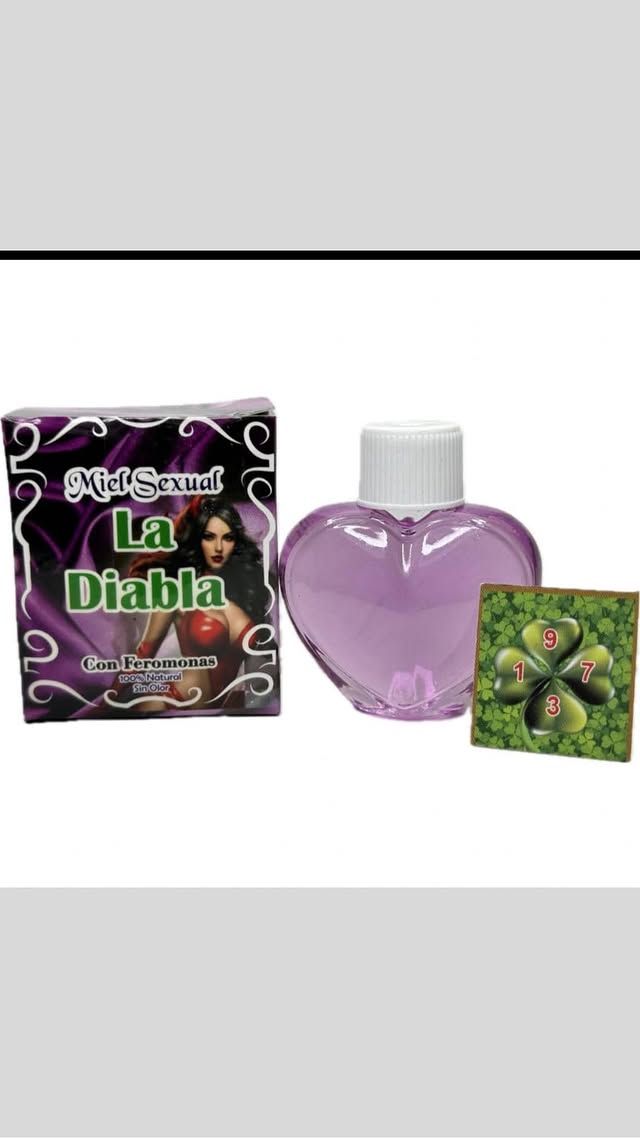 Product packaging with perfume bottle and clover. Purple bottle and box labeled