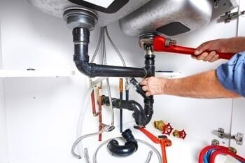 Plumber with a wrench