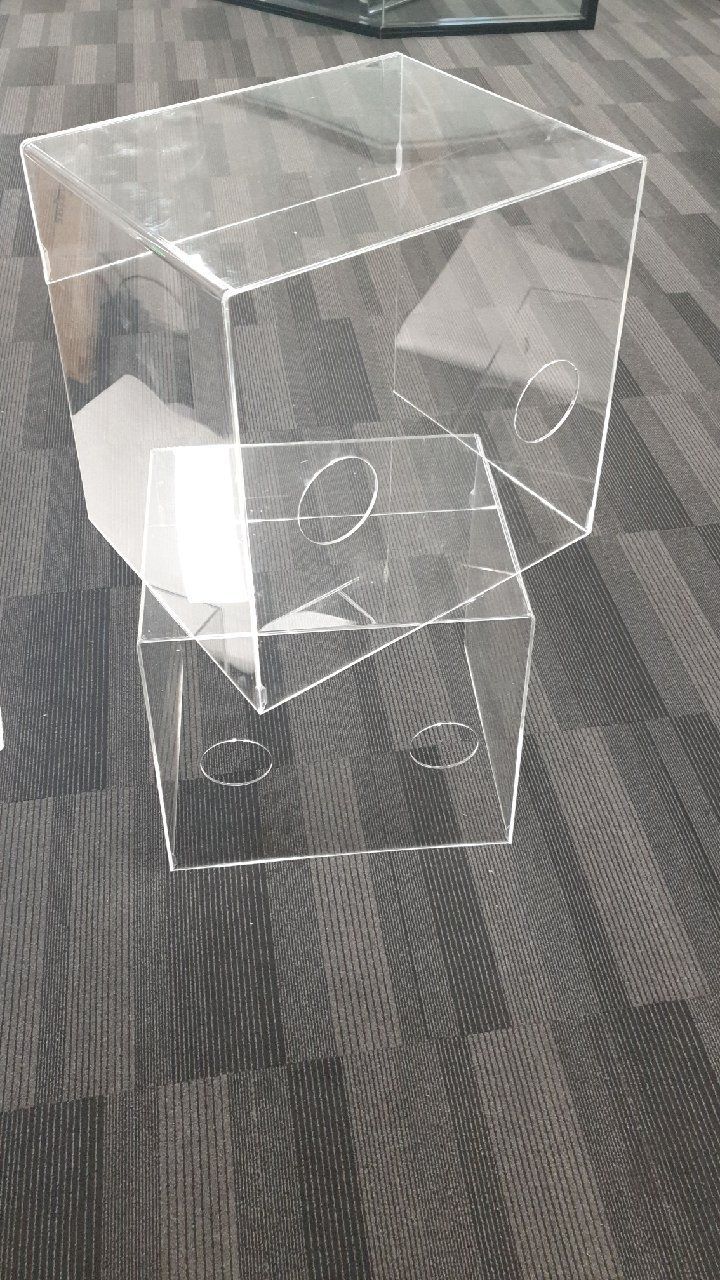 Three Clear Acrylic Boxes Are Stacked on Top of Each Other on a Carpeted Floor — Bent Plastics in Kunda Park, QLD