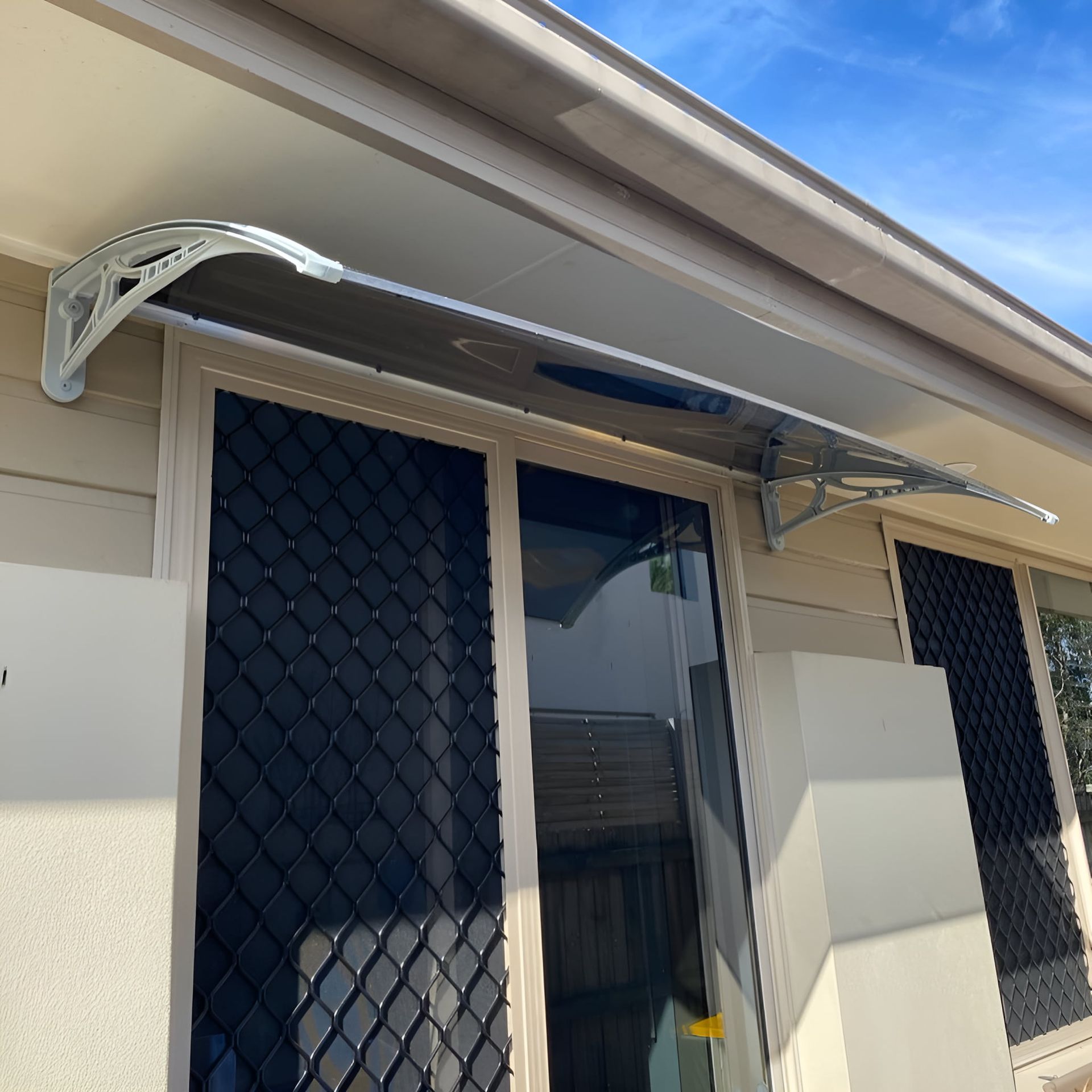 A Door With a Canopy Over It is on a House — Bent Plastics in Noosa, QLD