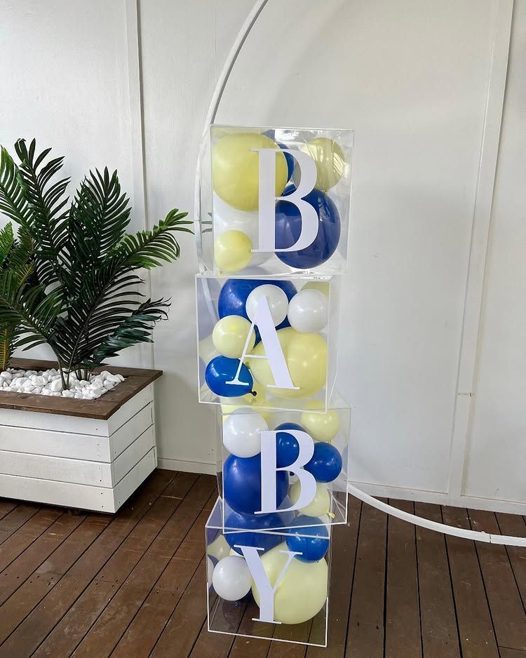A Stack of Clear Boxes Filled With Blue and Yellow Balloons — Bent Plastics in Kunda Park, QLD