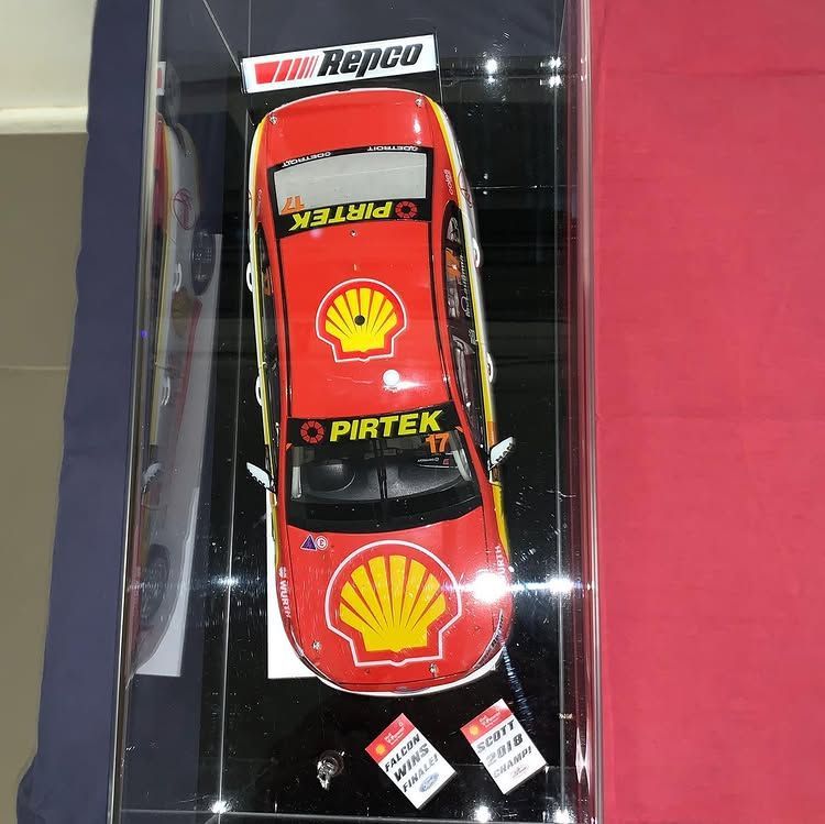 A Red Car With a Shell Logo on It is in a Display Case — Bent Plastics in Kunda Park, QLD