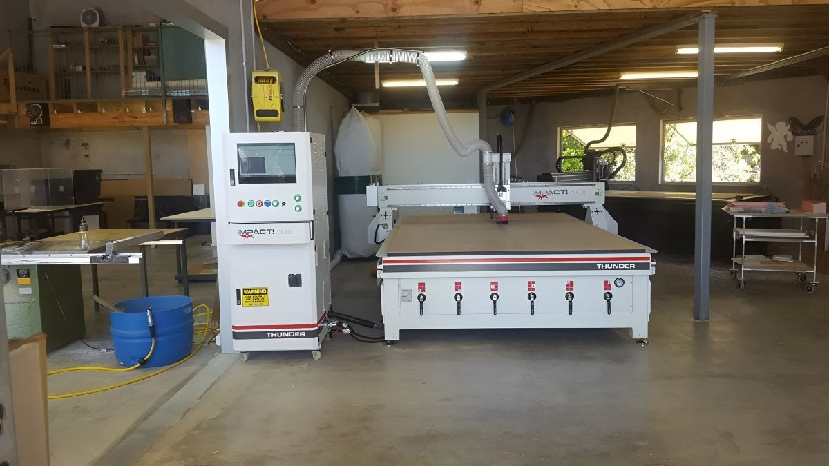 A Large Machine Is Sitting In The Middle Of A Room — Bent Plastics in Noosa, QLD