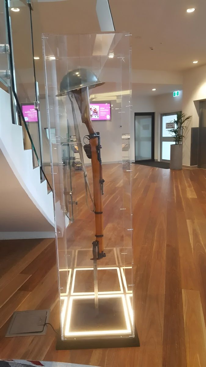 A Gun And Helmet Is Inside A Plastic Frame — Bent Plastics in Maroochydore, QLD